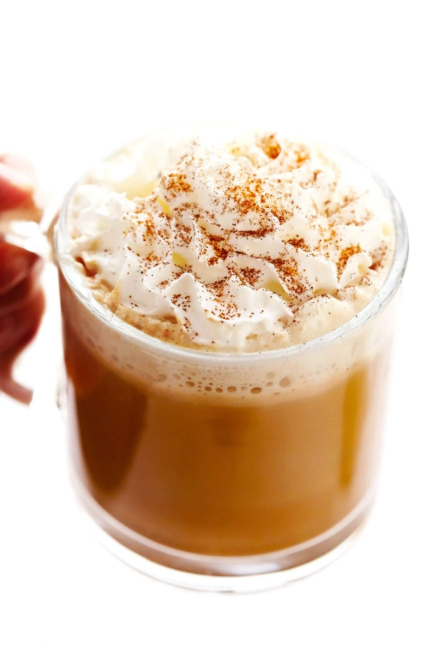 This homemade pumpkin spice latte recipe is inspired by the Starbucks version, yet lightened up a bit and naturally sweetened with maple syrup. Feel free to use your favorite kind of milk and make your drink with either espresso or very strongly brewed coffee. | gimmesomeoven.com Mug of Pumpkin Spice Latte