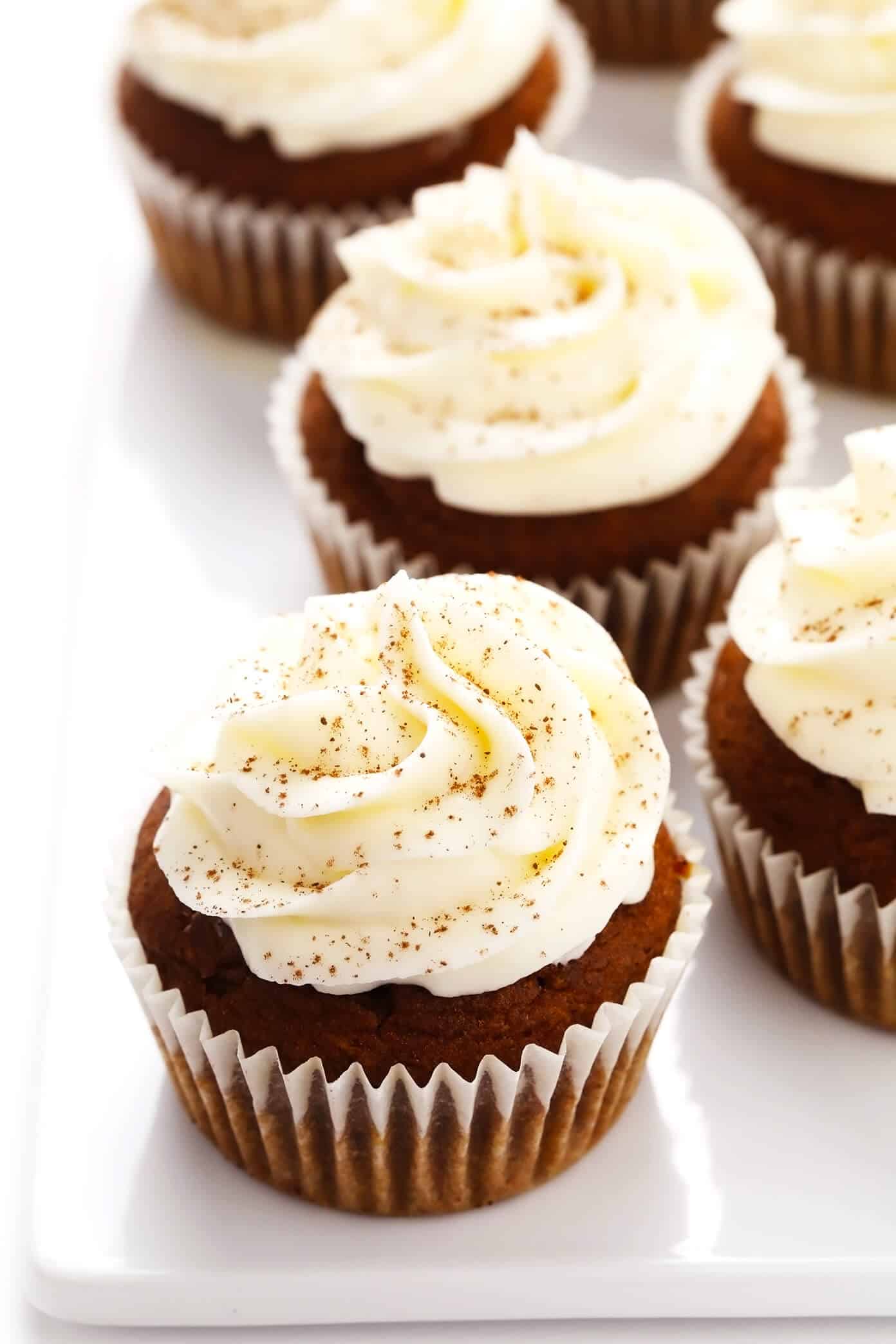 These pumpkin cupcakes are quick and easy to make, perfectly moist and fluffy and flavorful, and topped with the most heavenly cream cheese frosting. | gimmesomeoven.com #pumpkin #cupcakes #cake #creamcheese #frosting #icing #thanksgiving #halloween #fall #dessert Pumpkin Cupcakes Closeup