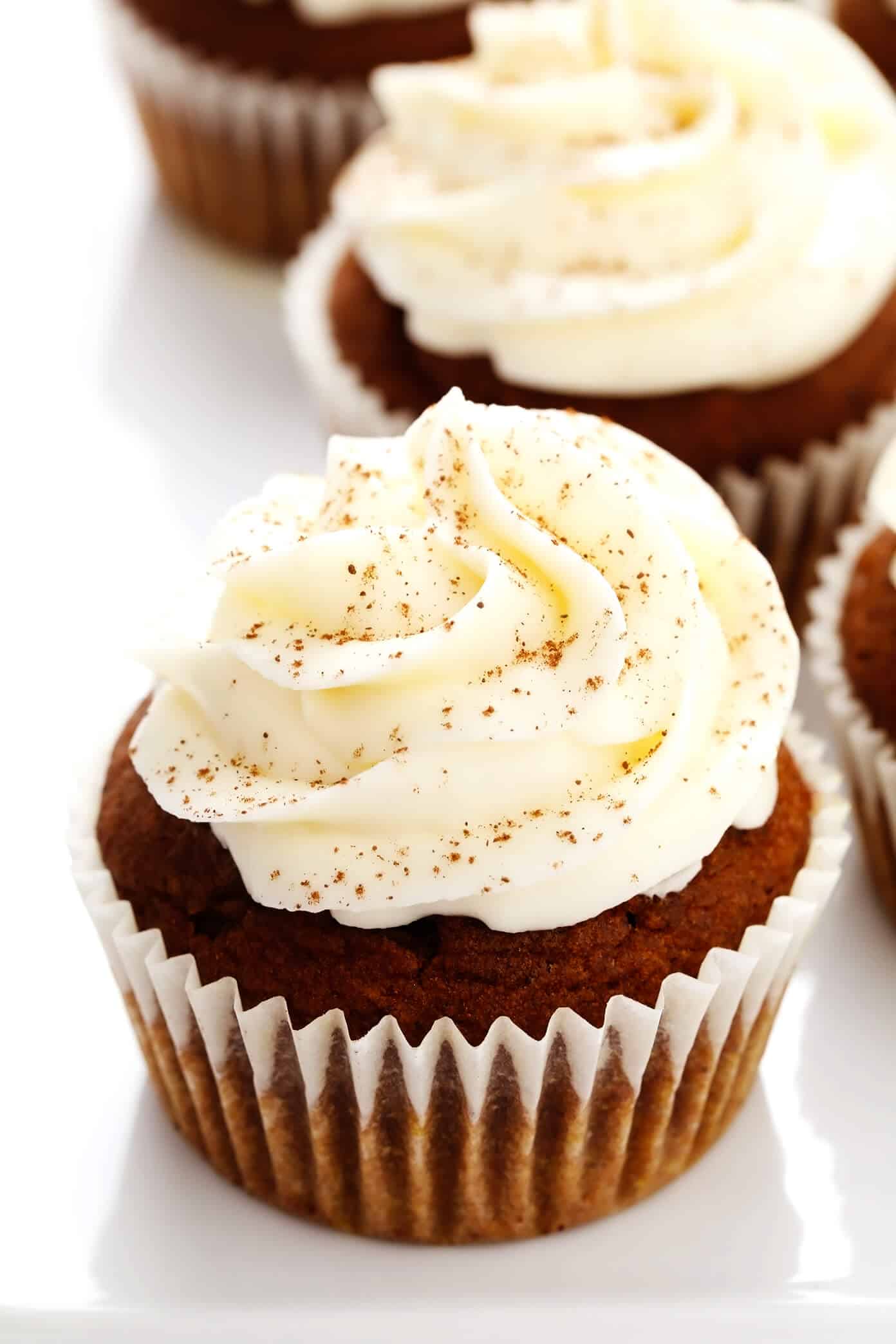 These pumpkin cupcakes are quick and easy to make, perfectly moist and fluffy and flavorful, and topped with the most heavenly cream cheese frosting. | gimmesomeoven.com #pumpkin #cupcakes #cake #creamcheese #frosting #icing #thanksgiving #halloween #fall #dessert Pumpkin Cupcakes with Cream Cheese Frosting