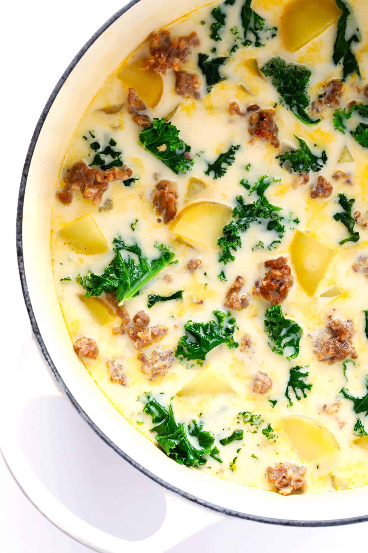 Learn how to make this favorite Olive Garden soup on the stovetop or in the slow cooker! This Zuppa Toscana recipe is super easy to make, naturally gluten-free, and full of the most delicious zesty, creamy flavors. So grab some Italian sausage, kale, potatoes, bacon, Parmesan, and garlic, and make it happen! Crock-pot instructions also included.