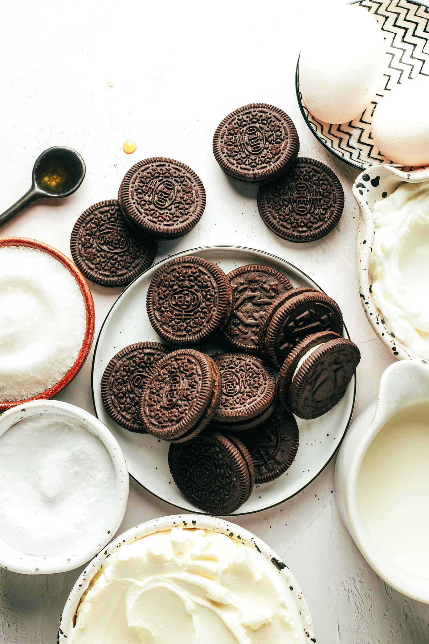 These mini Oreo cheesecakes are easy to make with a delicious mix of cookies and cream, featuring a whole chocolate Oreo as the "crust." Such a fun, simple, and delicious make-ahead dessert! | gimmesomeoven.com Mini Oreo Cheesecake Ingredients