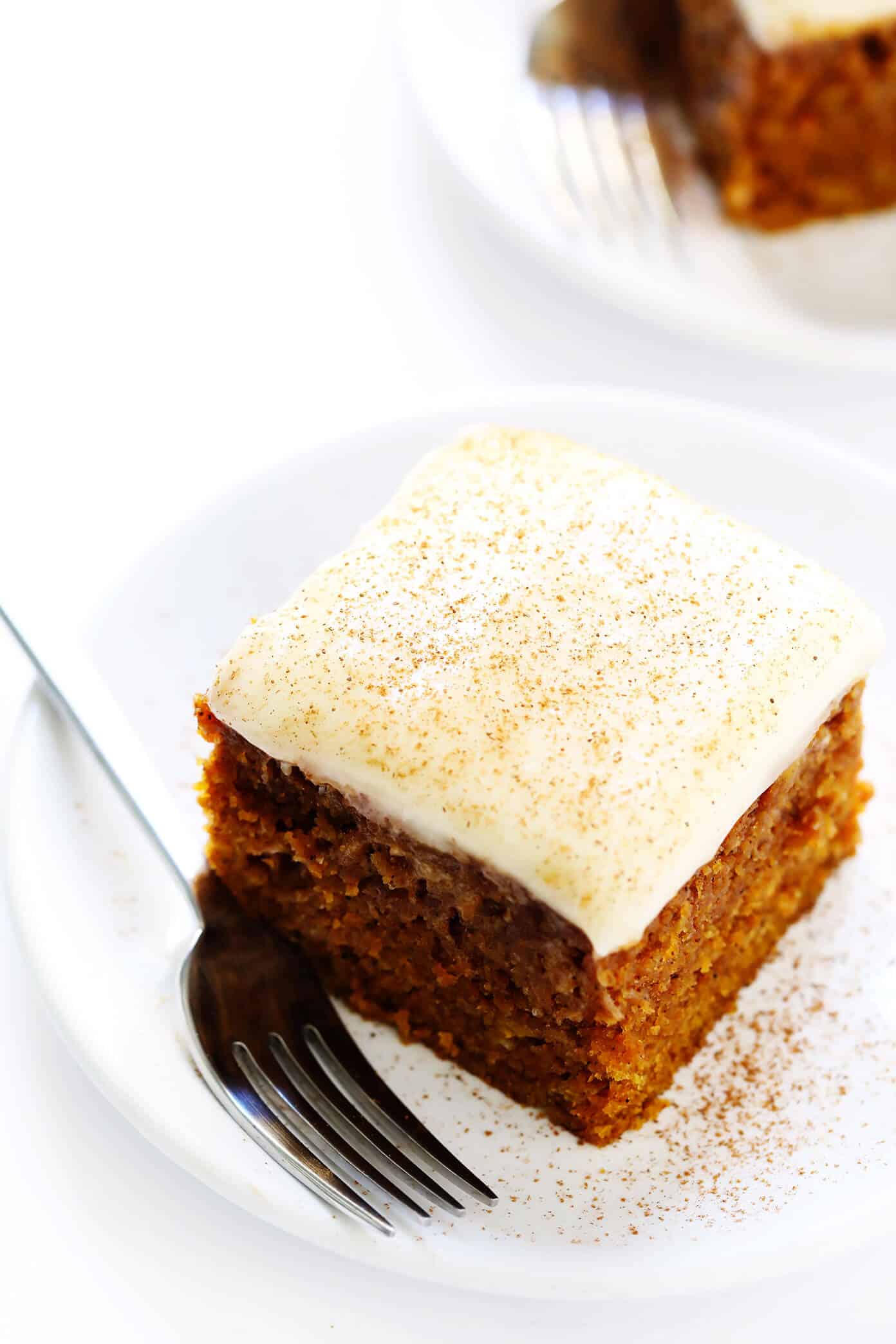 The BEST pumpkin bars recipe! They are nice and moist, made with the perfect amount of pumpkin spice, and topped with the most heavenly cream cheese frosting. The perfect fall or Thanksgiving dessert! | gimmesomeoven.com #pumpkin #bars #dessert #creamcheese #frosting #thanksgiving #fall #baking #cake Pumpkin Bars with Cream Cheese Frosting