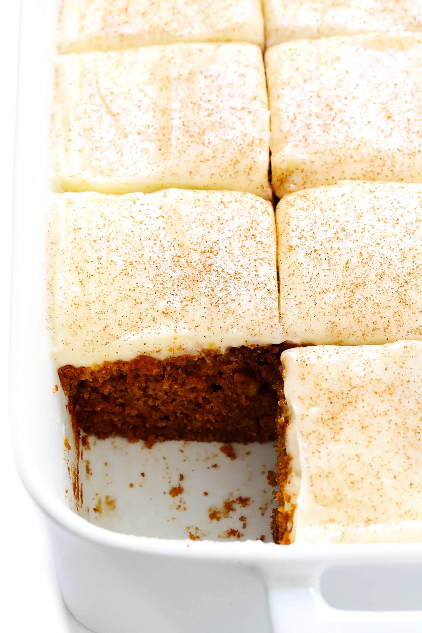 The BEST pumpkin bars recipe! They are nice and moist, made with the perfect amount of pumpkin spice, and topped with the most heavenly cream cheese frosting. The perfect fall or Thanksgiving dessert! | gimmesomeoven.com #pumpkin #bars #dessert #creamcheese #frosting #thanksgiving #fall #baking #cake Pumpkin Bars with Cream Cheese Icing Recipe