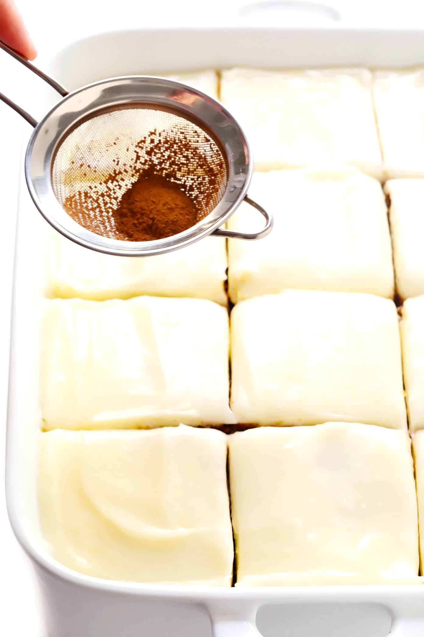 The BEST pumpkin bars recipe! They are nice and moist, made with the perfect amount of pumpkin spice, and topped with the most heavenly cream cheese frosting. The perfect fall or Thanksgiving dessert! | gimmesomeoven.com #pumpkin #bars #dessert #creamcheese #frosting #thanksgiving #fall #baking #cake How To Make Pumpkin Bars with Cream Cheese Frosting
