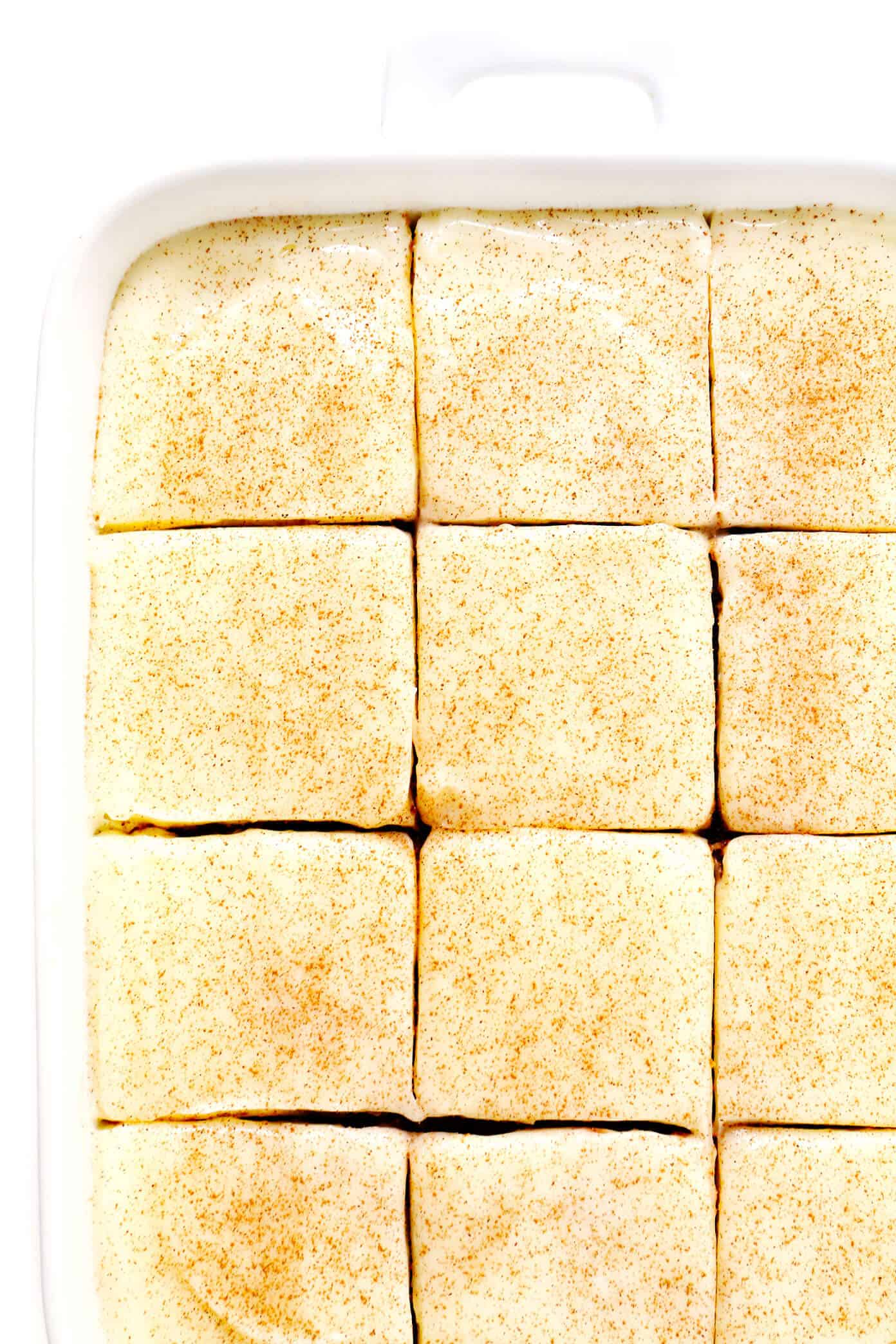 The BEST pumpkin bars recipe! They are nice and moist, made with the perfect amount of pumpkin spice, and topped with the most heavenly cream cheese frosting. The perfect fall or Thanksgiving dessert! | gimmesomeoven.com #pumpkin #bars #dessert #creamcheese #frosting #thanksgiving #fall #baking #cake Pumpkin Bars Recipe