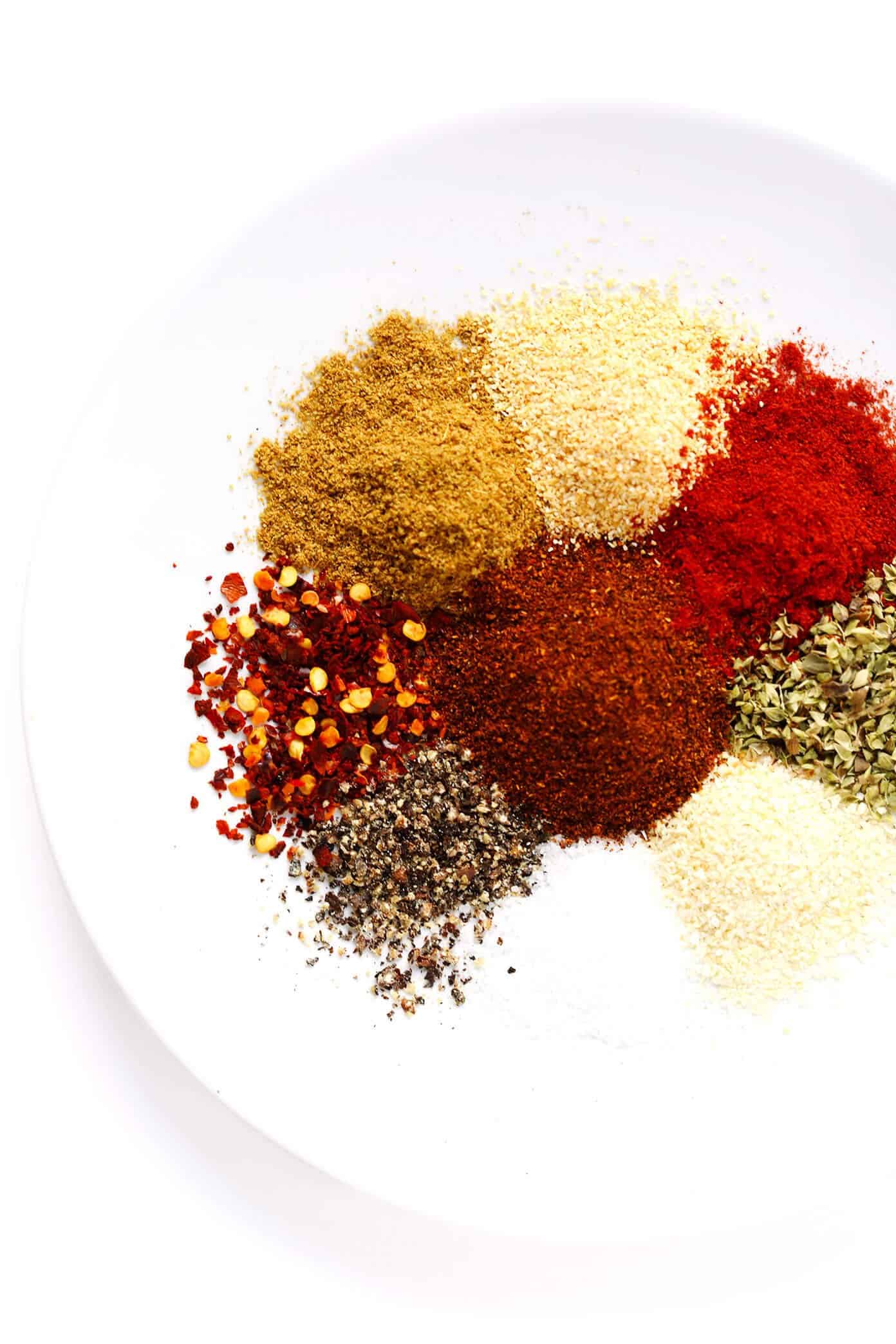 This homemade taco seasoning recipe is easy to make in just a few minutes with ingredients you already have in your spice cabinet. And it tastes great with everything from proteins (chicken, beef, pork, shrimp, tofu, etc.) to veggies, rice, beans, dips, salsa and more. | gimmesomeoven.com Homemade Taco Seasoning Ingredients