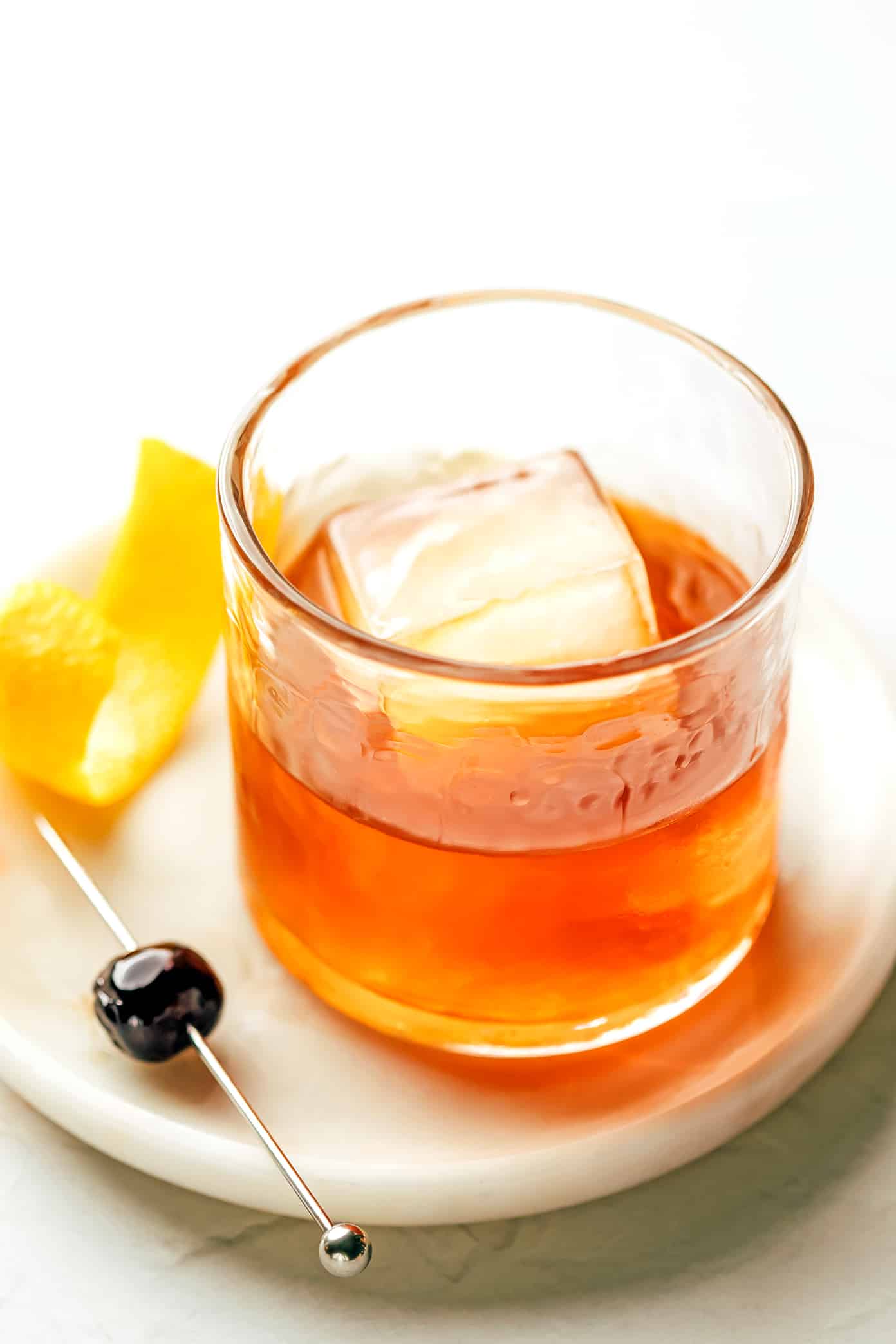 This classic old fashioned recipe is easy to make with bourbon, bitters, orange peel and your choice of sweetener. Such a simple, satisfying and swanky cocktail that never disappoints! | gimmesomeoven.com Old Fashioned Drink with Luxardo Cherry and Orange Peel