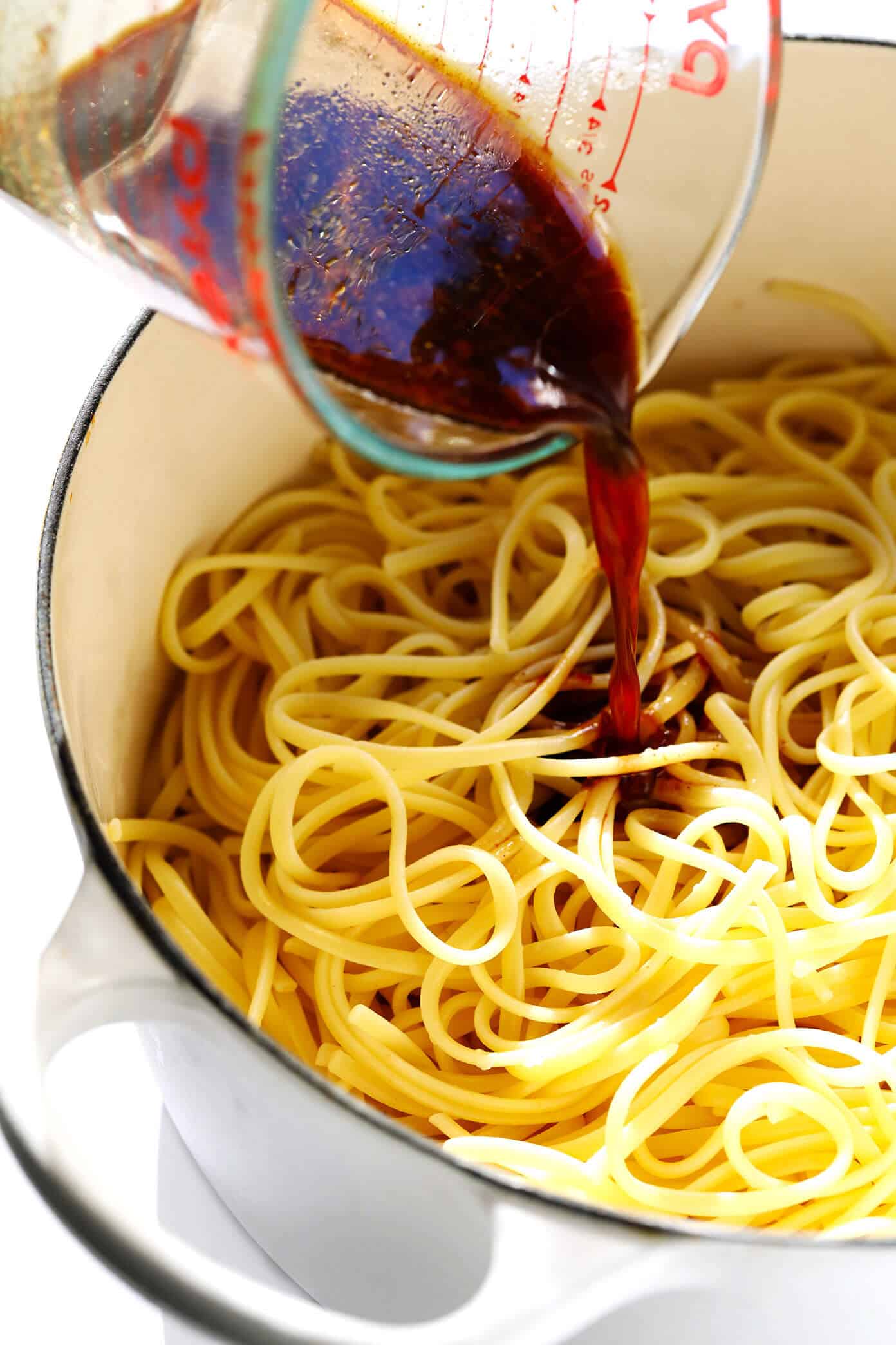 This 15-Minute Sesame Noodles recipe is super easy to make is just as delicious served warm or cold as a side dish. Feel free to add in extra veggies and/or proteins (such as chicken, beef, shrimp, tofu, etc.) to make it a main course! | gimmesomeoven.com #noodles #sesame #side #sauce #chinese #dinner #pasta How To Make Sesame Noodles