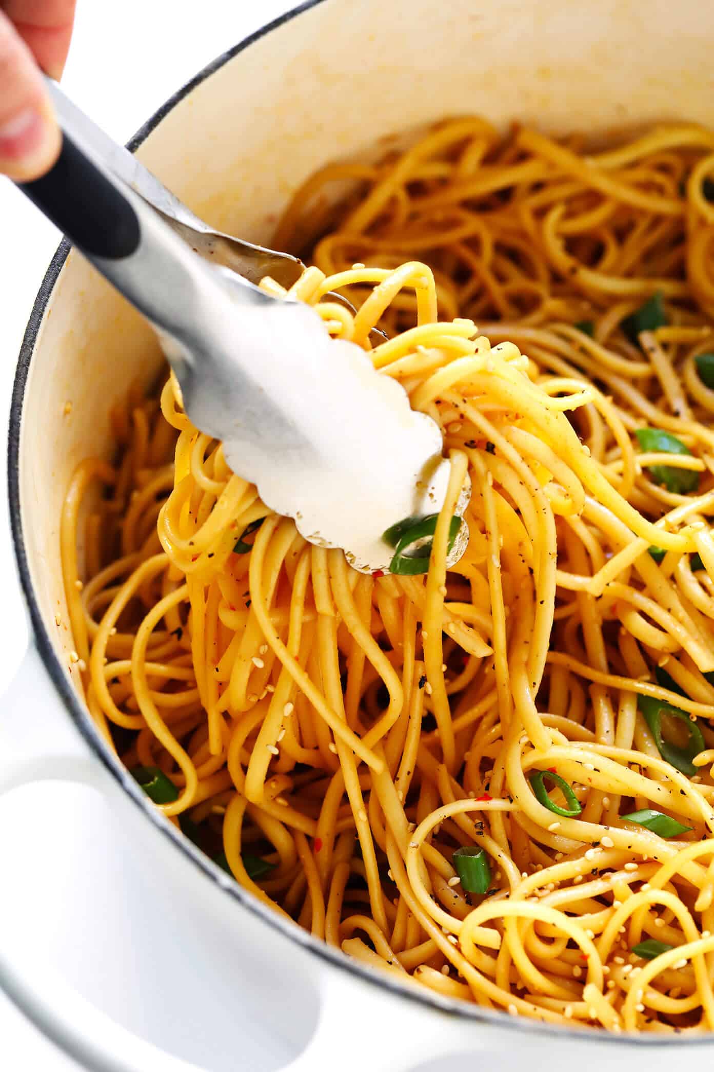 This 15-Minute Sesame Noodles recipe is super easy to make is just as delicious served warm or cold as a side dish. Feel free to add in extra veggies and/or proteins (such as chicken, beef, shrimp, tofu, etc.) to make it a main course! | gimmesomeoven.com #noodles #sesame #side #sauce #chinese #dinner #pasta Sesame Noodles Recipe