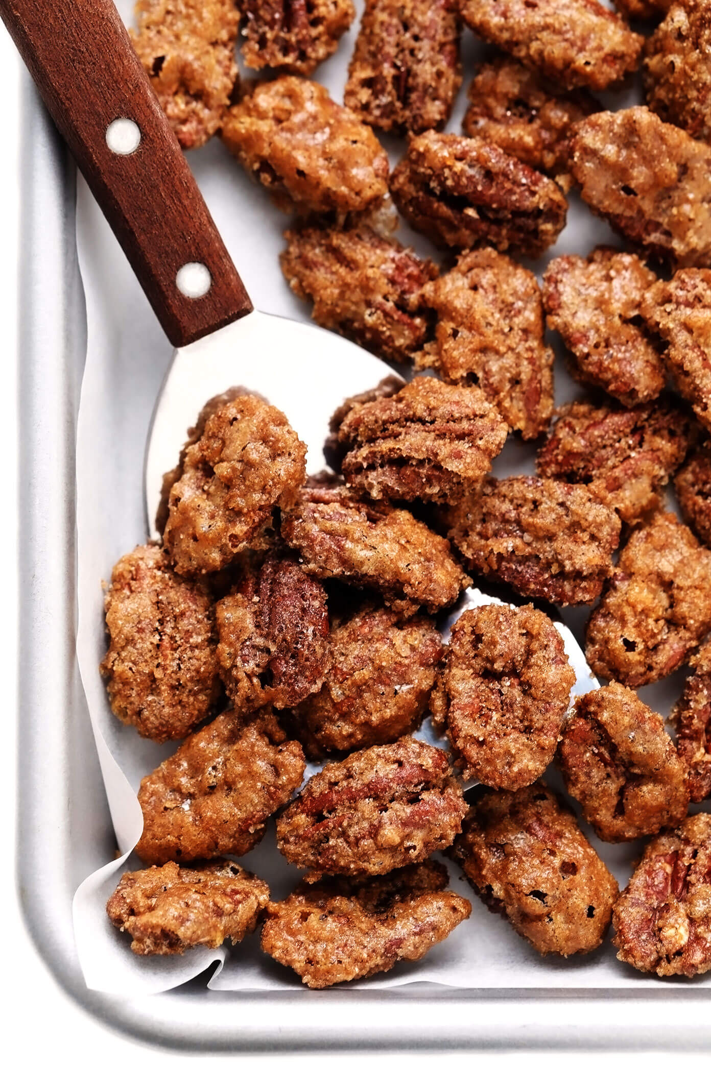 My favorite classic candied pecans recipe is made with a crunchy cinnamon sugar coating that is perfectly seasoned with a hint of sea salt and cayenne. Easy to make with 7 ingredients, naturally gluten-free, and perfect for topping salads, casseroles, yogurt, ice cream and more! | gimmesomeoven.com #candied #pecans #nuts #dessert #salad #topping #glutenfree #candy Candied pecans recipe close-up