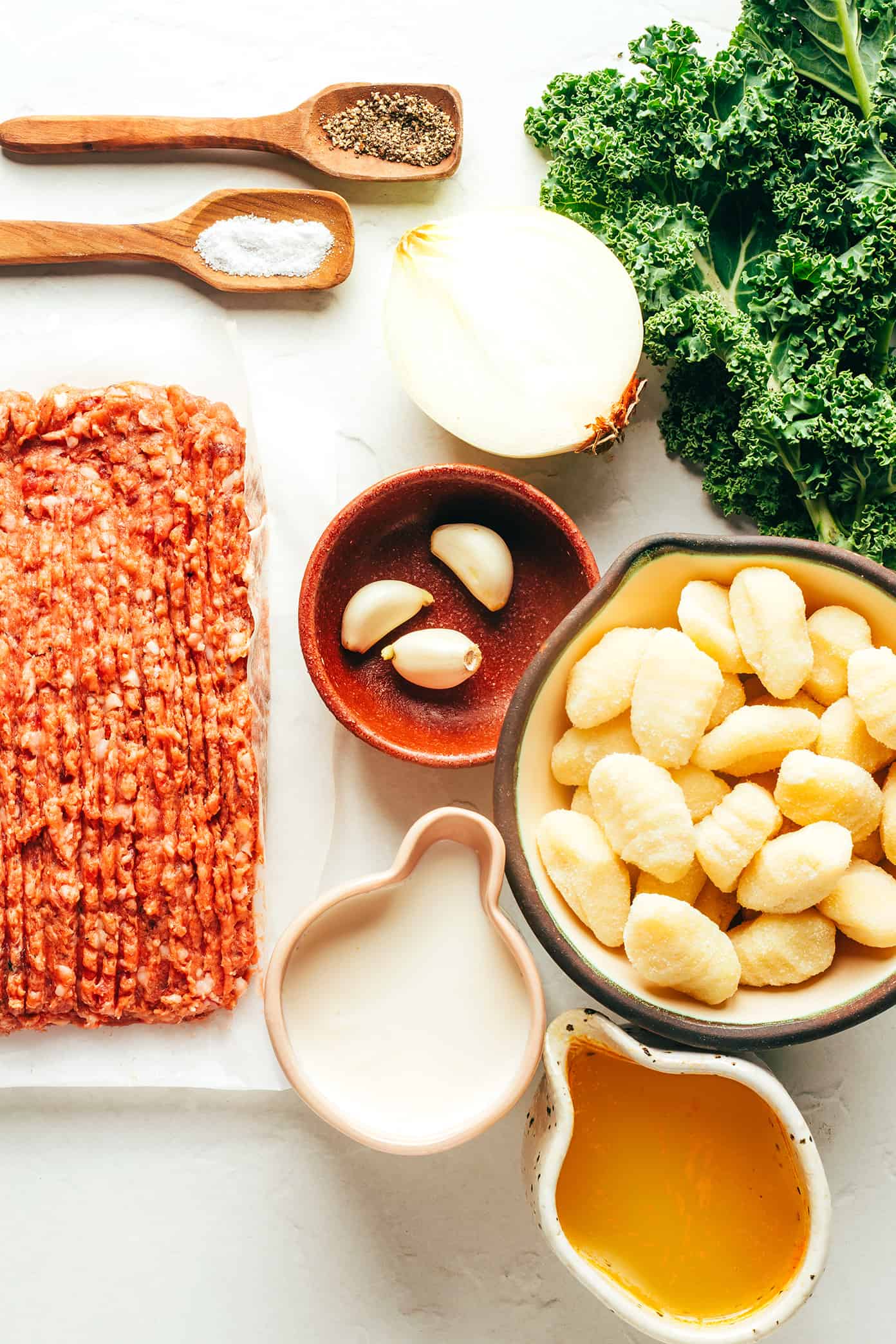 This easy Zuppa Toscana recipe, inspired by the Olive Garden version, uses store-bought gnocchi as a shortcut to bring this delicious creamy sausage and kale soup together in less than 30 minutes. A gluten-free dinner recipe that's easy to also make vegetarian (with plant-based sausage) if you prefer! | gimmesomeoven.com Zuppa Toscana Ingredients