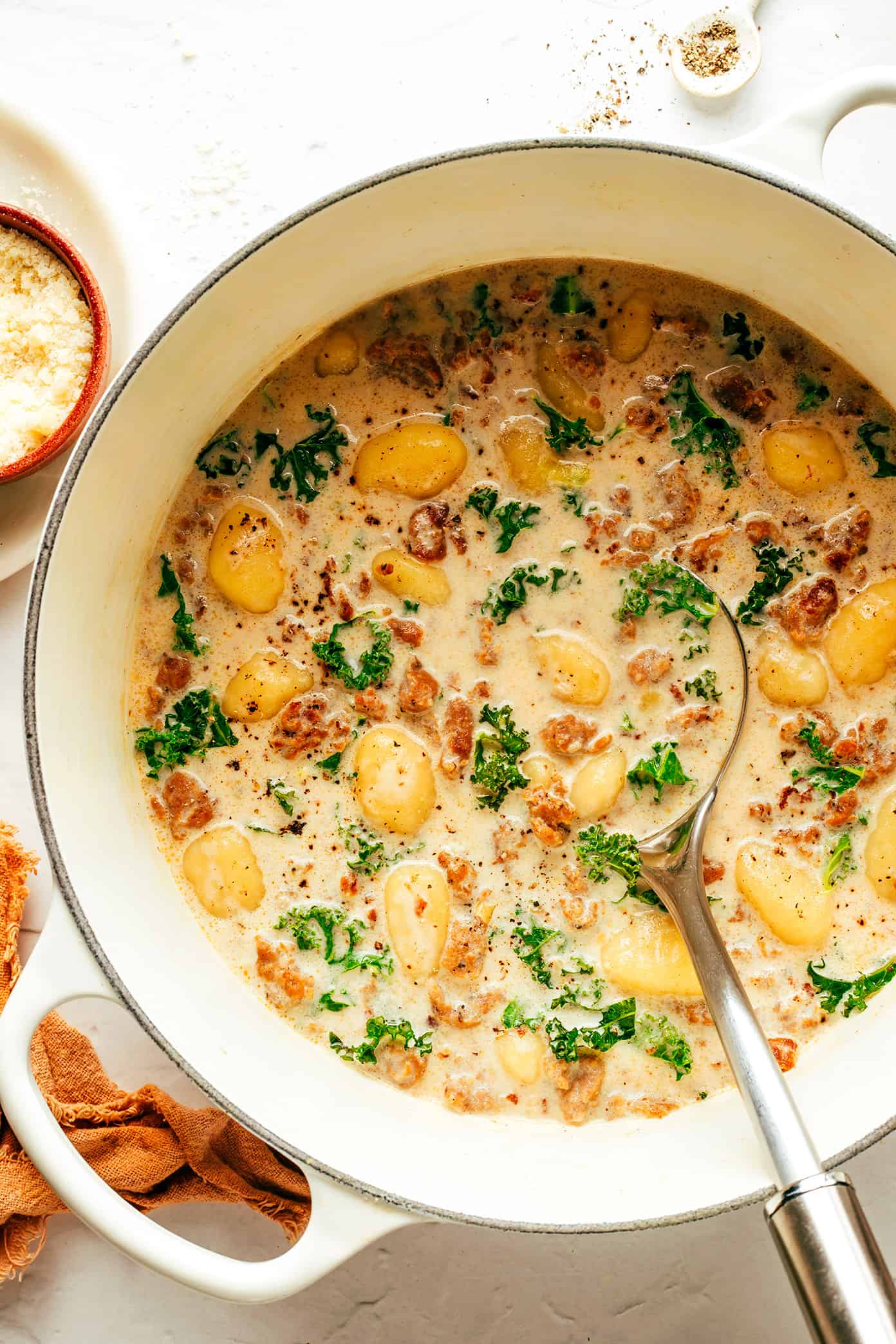 This easy Zuppa Toscana recipe, inspired by the Olive Garden version, uses store-bought gnocchi as a shortcut to bring this delicious creamy sausage and kale soup together in less than 30 minutes. A gluten-free dinner recipe that's easy to also make vegetarian (with plant-based sausage) if you prefer! | gimmesomeoven.com Easy Gnocchi Zuppa Toscana in Pot