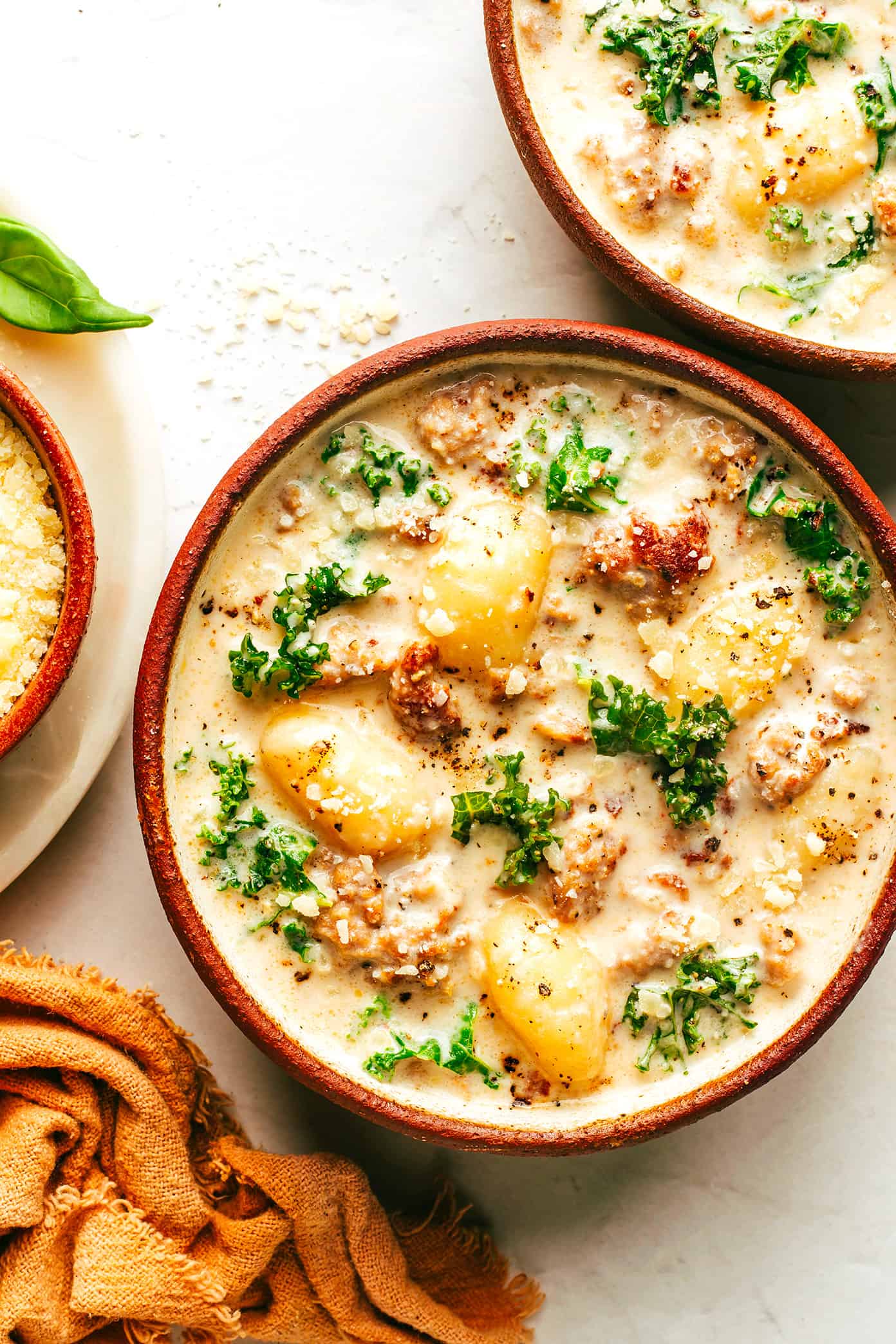 This easy Zuppa Toscana recipe, inspired by the Olive Garden version, uses store-bought gnocchi as a shortcut to bring this delicious creamy sausage and kale soup together in less than 30 minutes. A gluten-free dinner recipe that's easy to also make vegetarian (with plant-based sausage) if you prefer! | gimmesomeoven.com Easy Zuppa Toscana Soup with Gnocchi