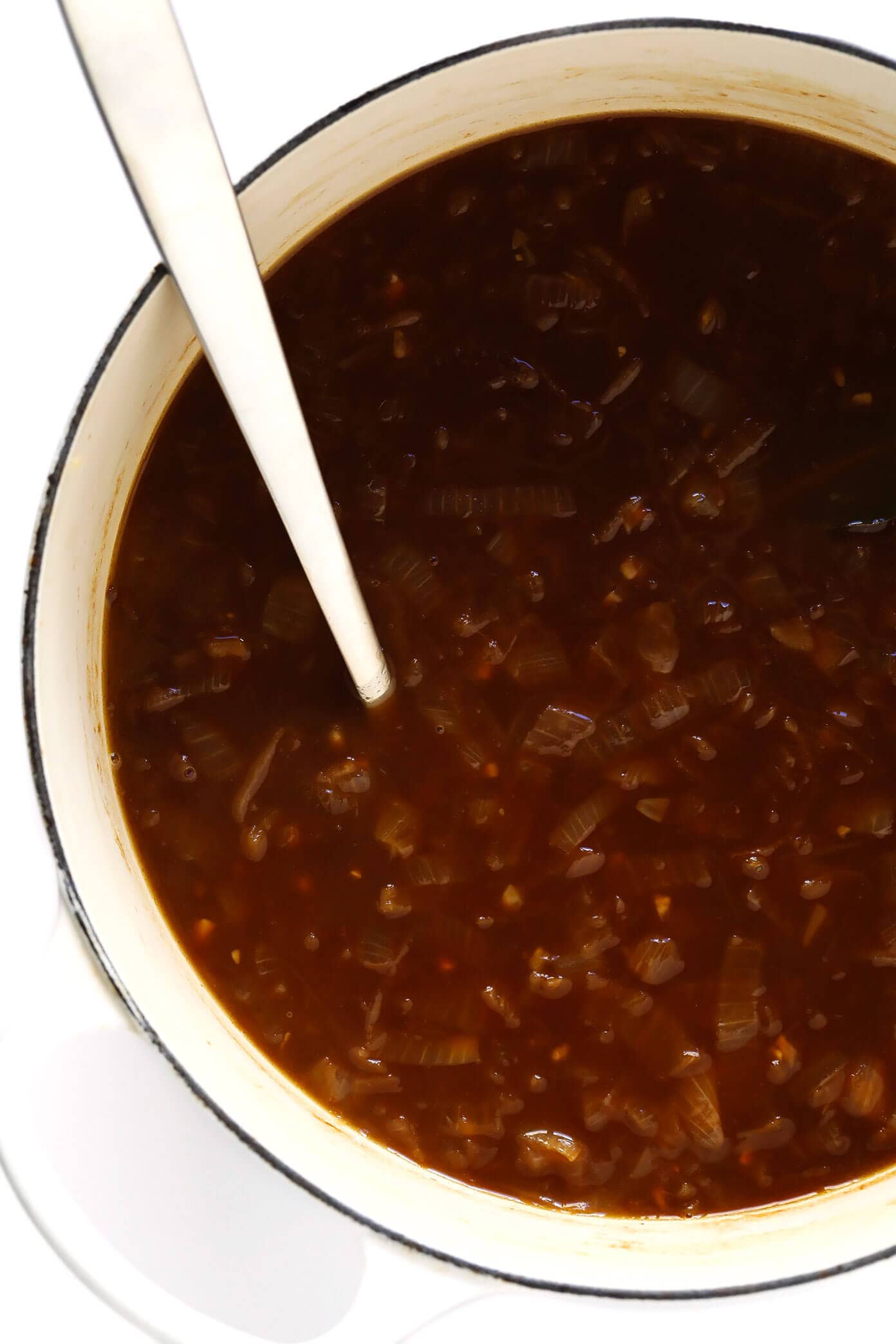 The BEST French Onion Soup recipe! It's easy to make, full of delicious caramelized onions, and topped with the classic cheesy baguette slices. A delicious vegetarian dinner recipe, perfect for fall and winter. | gimmesomeoven.com #onion #soup #dinner #vegetarian #recipe #caramelized #french #mealprep French Onion Soup