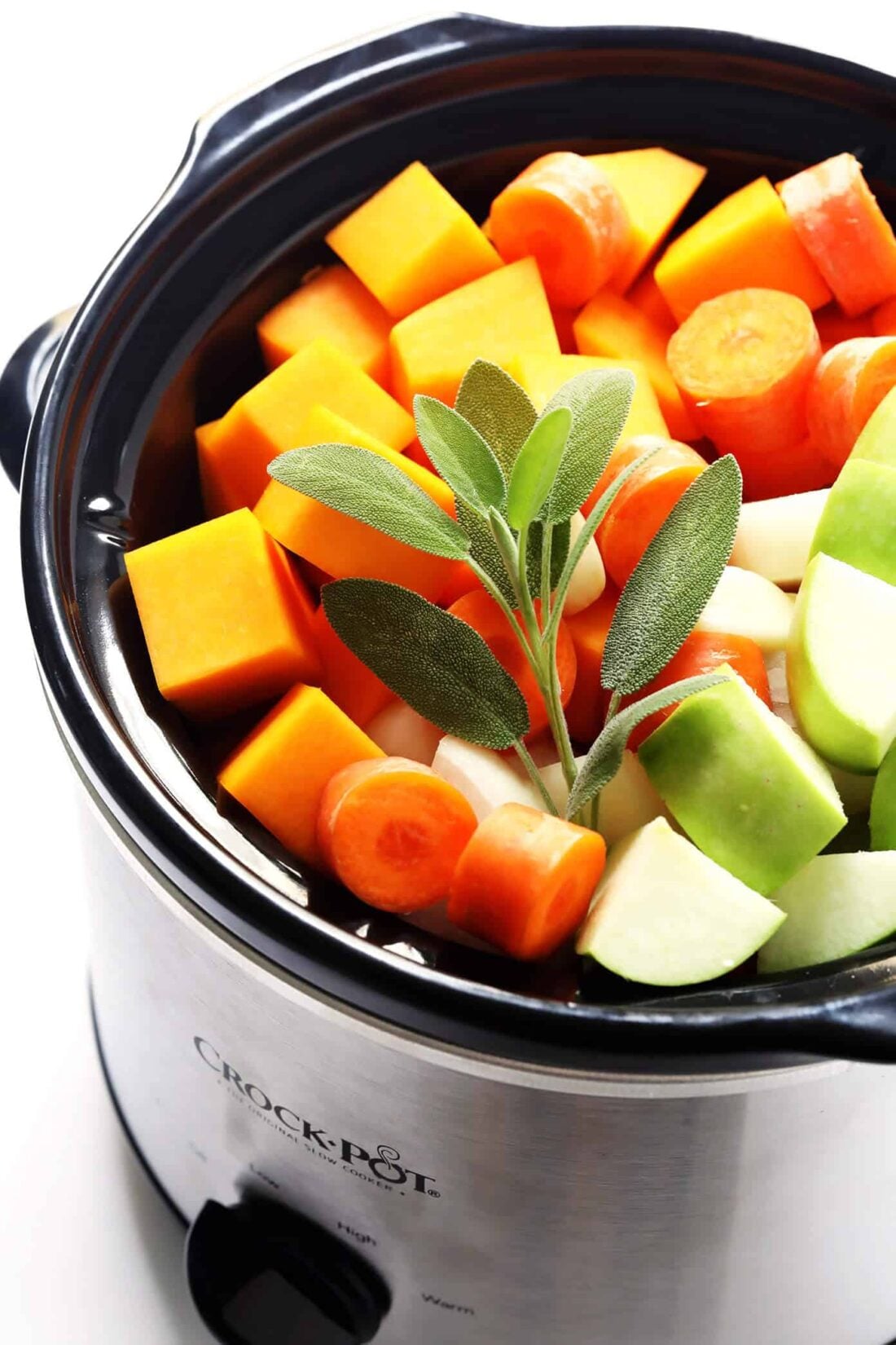This delicious Butternut Squash Soup recipe is quick and easy to make, loaded up with savory fall vegetables, lightened up with coconut milk (no heavy cream needed), and SO cozy and delicious. Naturally gluten-free, vegetarian, vegan and easy to make in either the Instant Pot, Crock Pot, or on the stovetop. The perfect healthy comfort food dinner recipe for fall or winter! | gimmesomeoven.com Crock Pot Butternut Squash Soup Ingredients