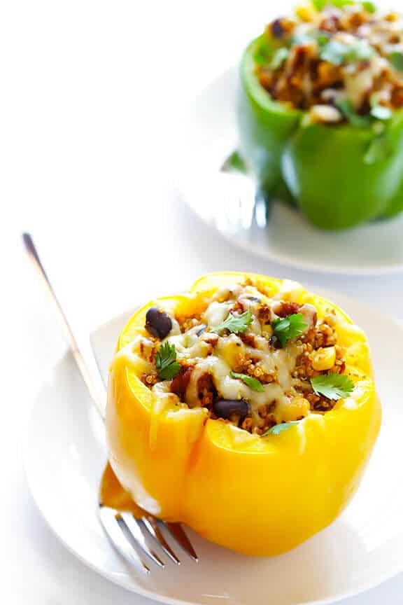 LOVE this 5-Ingredient Vegetarian Stuffed Peppers recipe! It's easy, cheesy, filled with lots of quinoa and black beans, and SO delicious! | gimmesomeoven.com