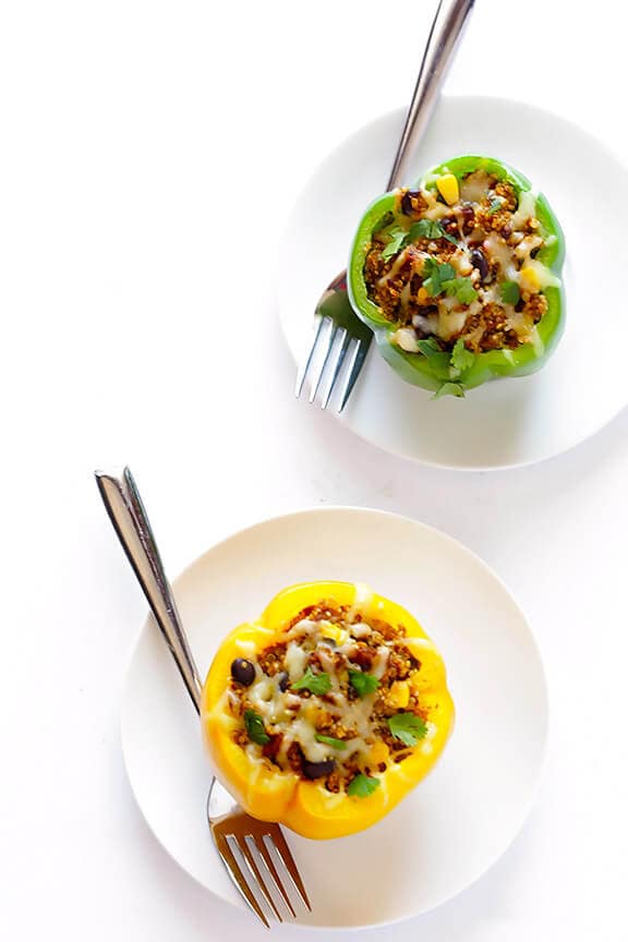 LOVE this 5-Ingredient Vegetarian Stuffed Peppers recipe! It's easy, cheesy, filled with lots of quinoa and black beans, and SO delicious! | gimmesomeoven.com