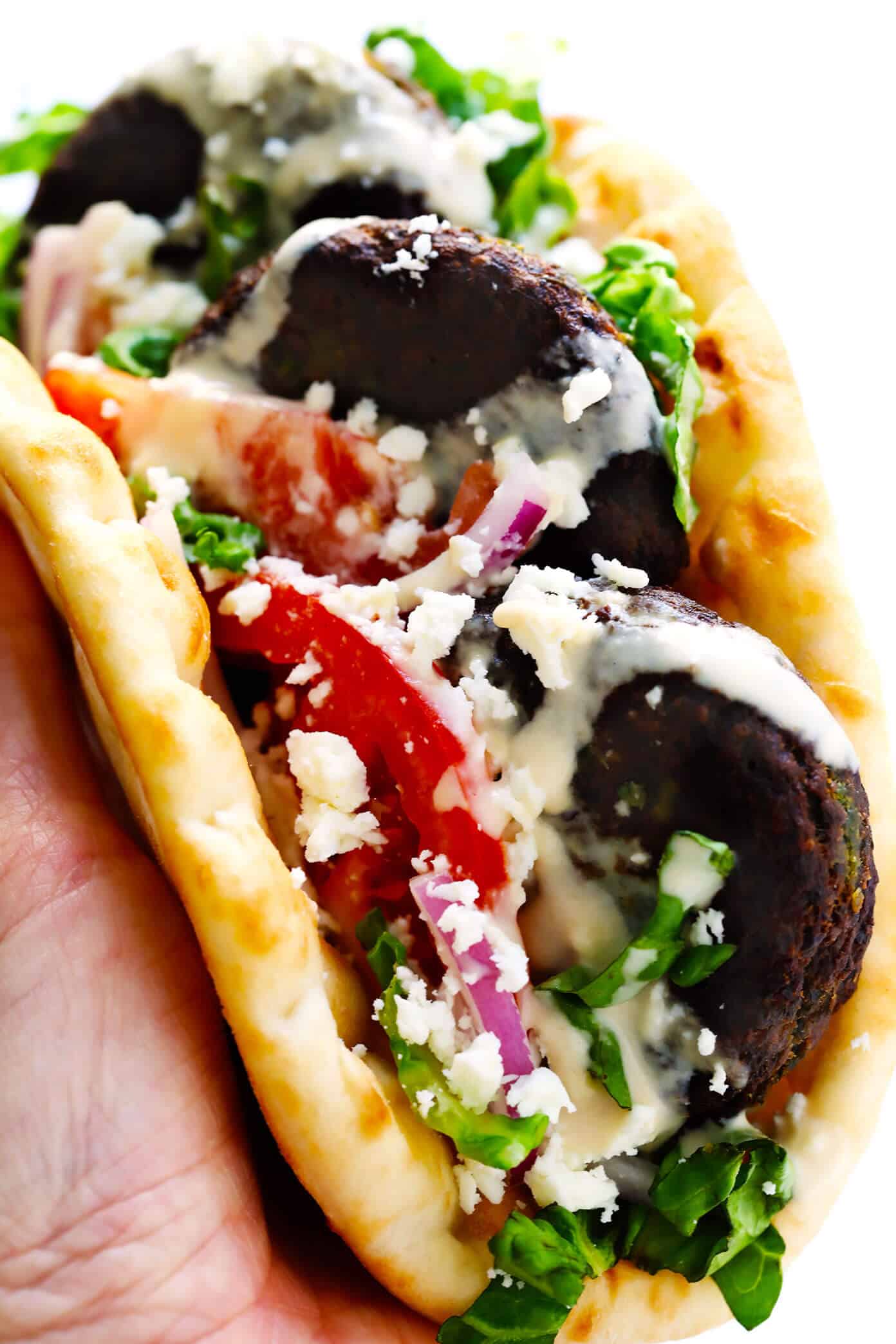 Learn how to make falafel with this easy homemade falafel recipe! It's bursting with zesty fresh fresh flavors, lightly pan-fried (instead of deep-fried), and perfect for falafel wraps, salads, sandwiches and more. Bonus, it's also naturally vegan and gluten-free. | gimmesomeoven.com #falafel #wrap #vegetarian #vegan #glutenfree #healthy #dinner #freezermeals Homemade Falafel Wrap