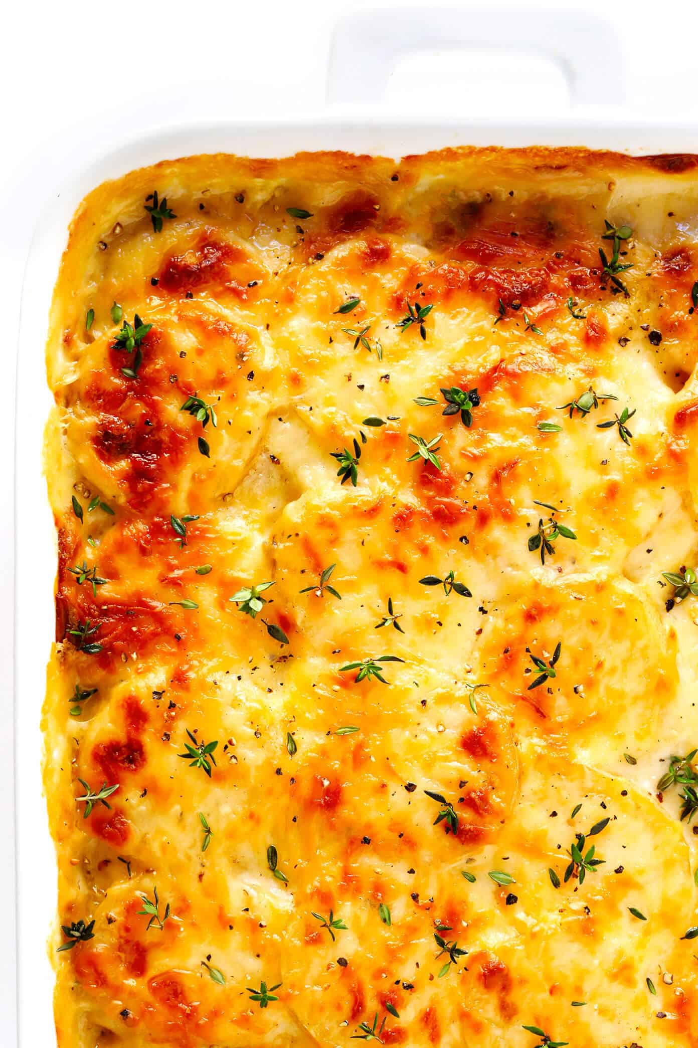 Truly the BEST scalloped potatoes recipe!! This simple side dish is easy to make, full of the most delicious creamy, garlicky, cheesy flavors, and it's always a crowd fave. Perfect for Thanksgiving, Christmas, Easter, or any time you need some irresistibly delicious potatoes in your life. | Gimme Some Oven #scalloped #potatoes #side #easter #christmas #thanksgiving #recipe Scalloped Potatoes