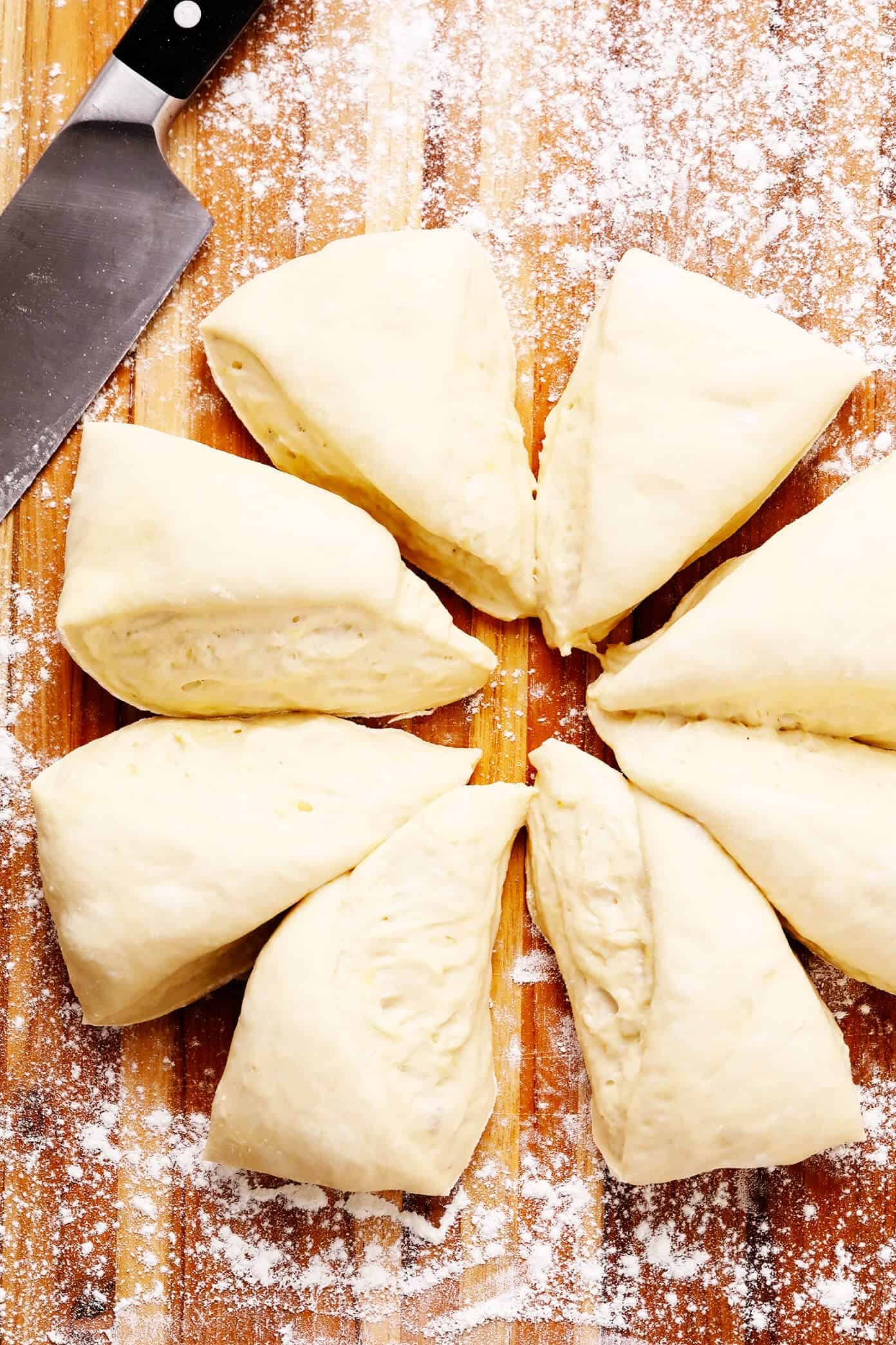 This homemade naan recipe is easy to make, perfectly soft and chewy, and always so delicious. I've included a garlic naan recipe option below too! | gimmesomeoven.com #naan #bread #flatbread #vegetarian #homemade #wrap #garlic Homemade Naan Dough Cut Into Wedges