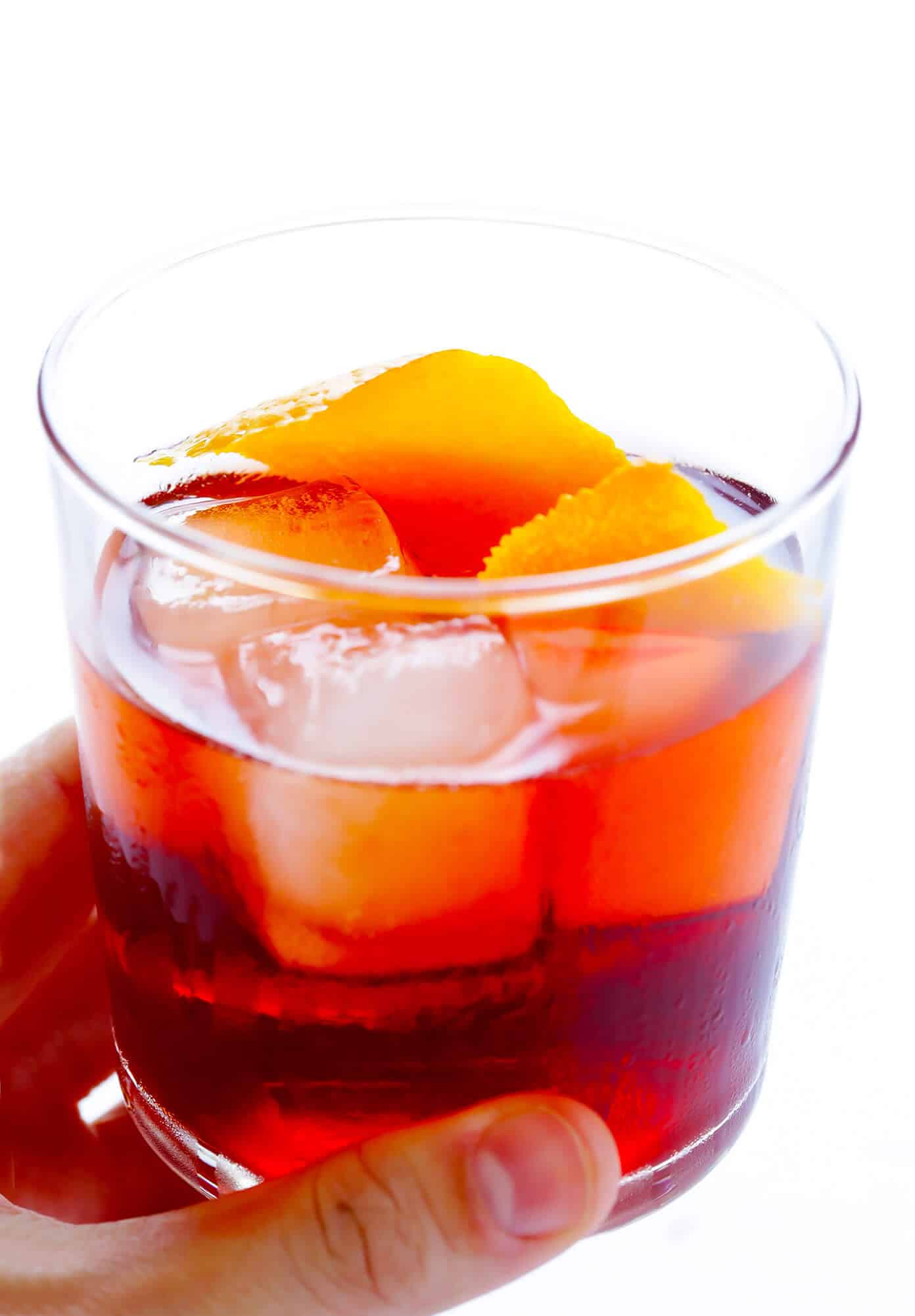 This classic negroni cocktail recipe is easy to make with three simple ingredients -- Campari, gin and sweet vermouth. It's the perfect cocktail for summer, Valentine's, 4th of July, or Christmas, and it's refreshingly not too sweet. | Gimme Some Oven #negroni #cocktail #gin #campari #vermouth #summer Negroni Recipe for #NegroniWeek