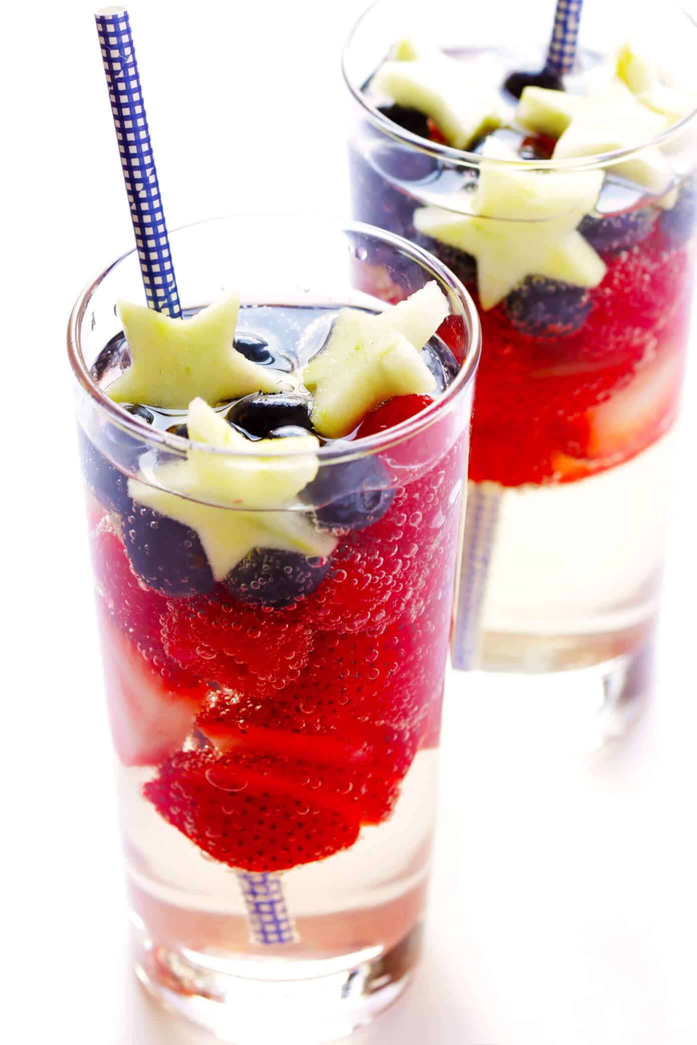 This Red, White and Blue Sparkling Sangria recipe is the perfect drink for the 4th of July or Memorial Day! It's easy to make with strawberries, blueberries, apples and your choice of wine...and always a party favorite! | gimmesomeoven.com #sangria #redwhiteandblue #cocktail #drink #4thofjuly #memorialday Sparkling Sangria for 4th of July