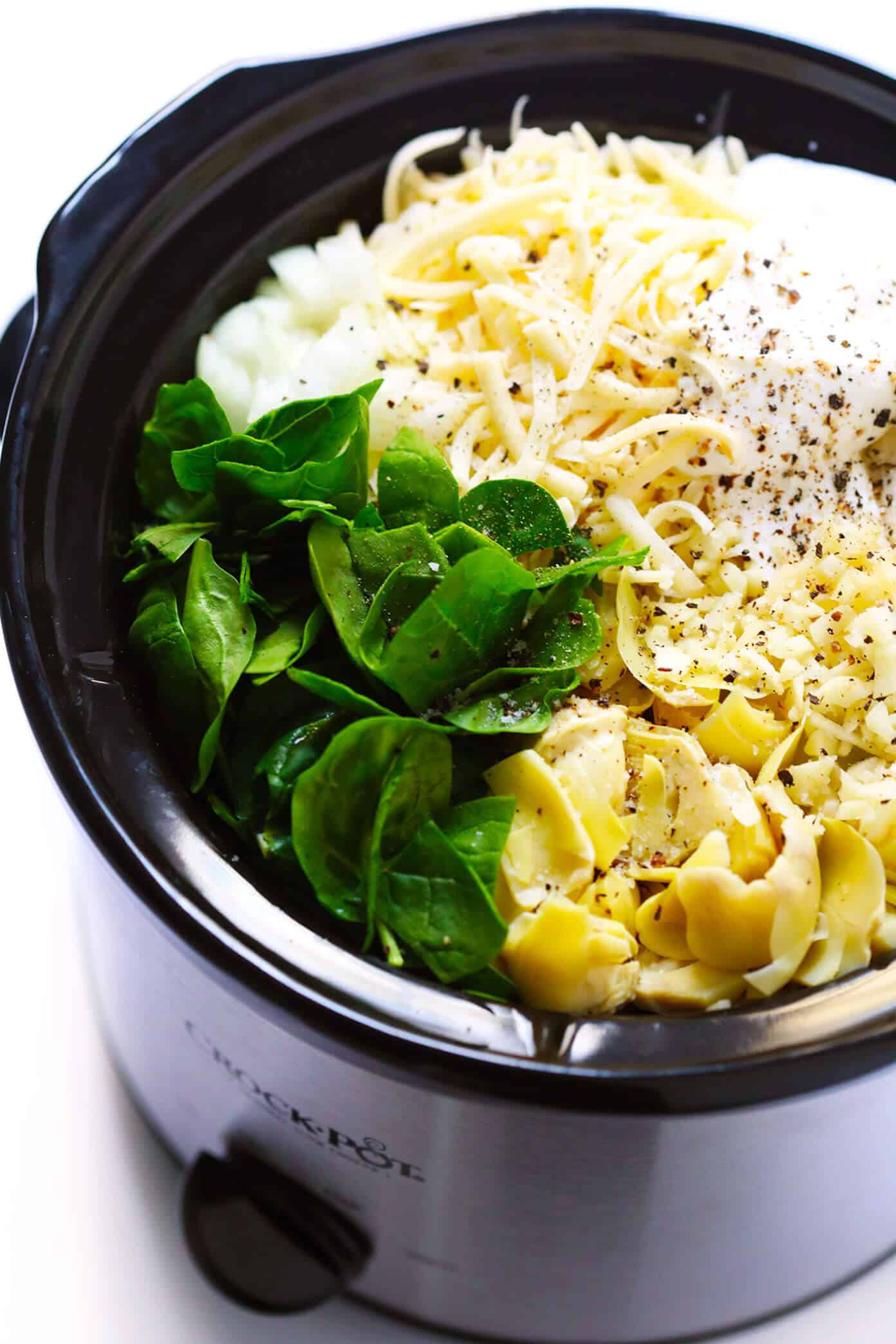 This Slow Cooker Spinach Artichoke Dip recipe is rich and creamy, full of great flavor, and extra-easy to make in the crockpot! The perfect easy appetizer or game day snack. | gimmesomeoven.com #dip #appetizer #spinach #artichoke #vegetarian #glutenfree #entertaining #holiday #gameday Crockpot Spinach Artichoke Dip Recipe