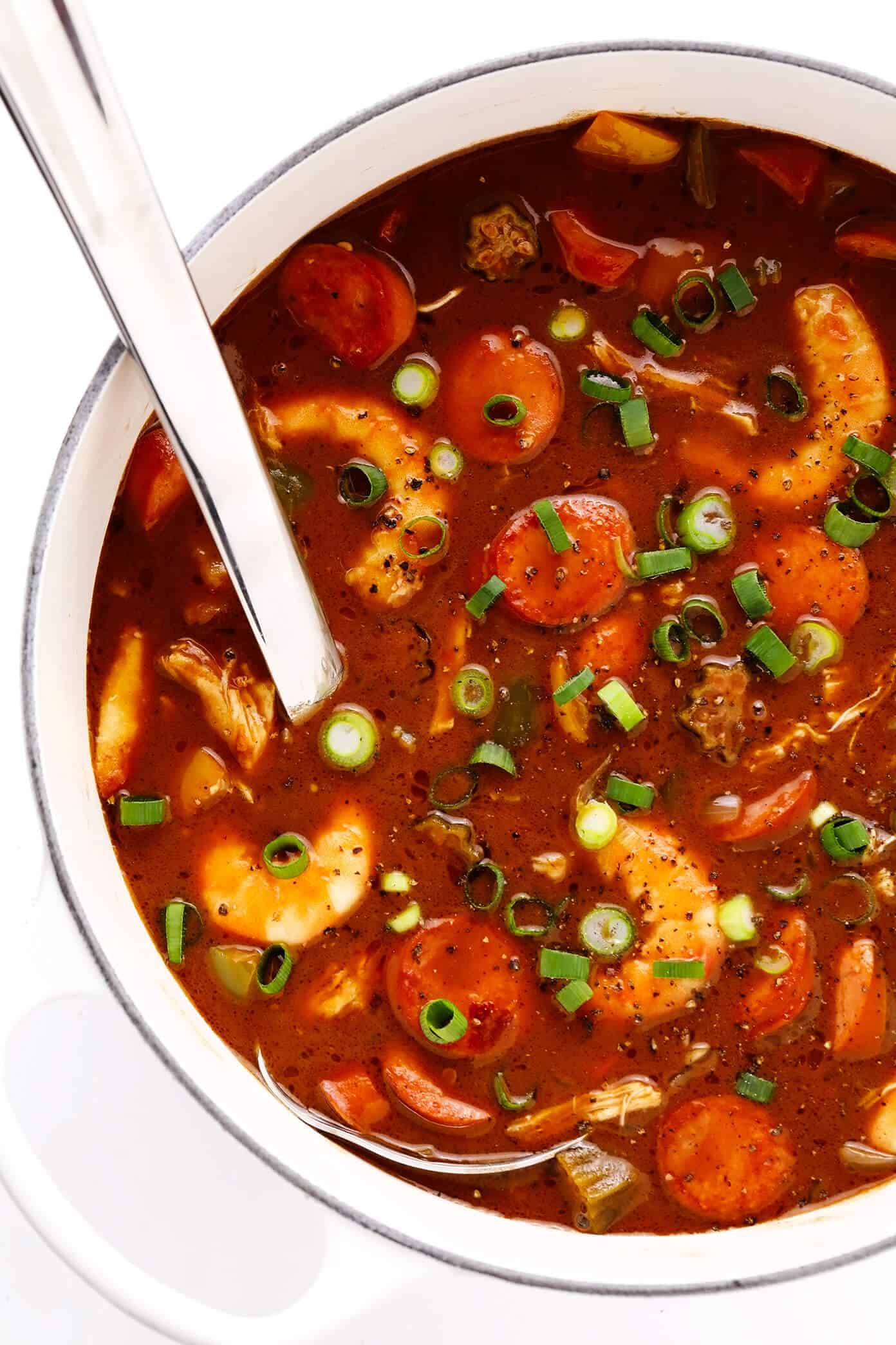 This Creole-style gumbo recipe is made with a richly-flavored dark roux, your choice of proteins (chicken, sausage and/or seafood), lots of veggies, and served over rice. So hearty, rich, and delicious! | gimmesomeoven.com #gumbo #soup #stew #creole #cajun #neworleans #mardigras #rice #dinner Pot of Chicken, Sausage and Seafood Gumbo