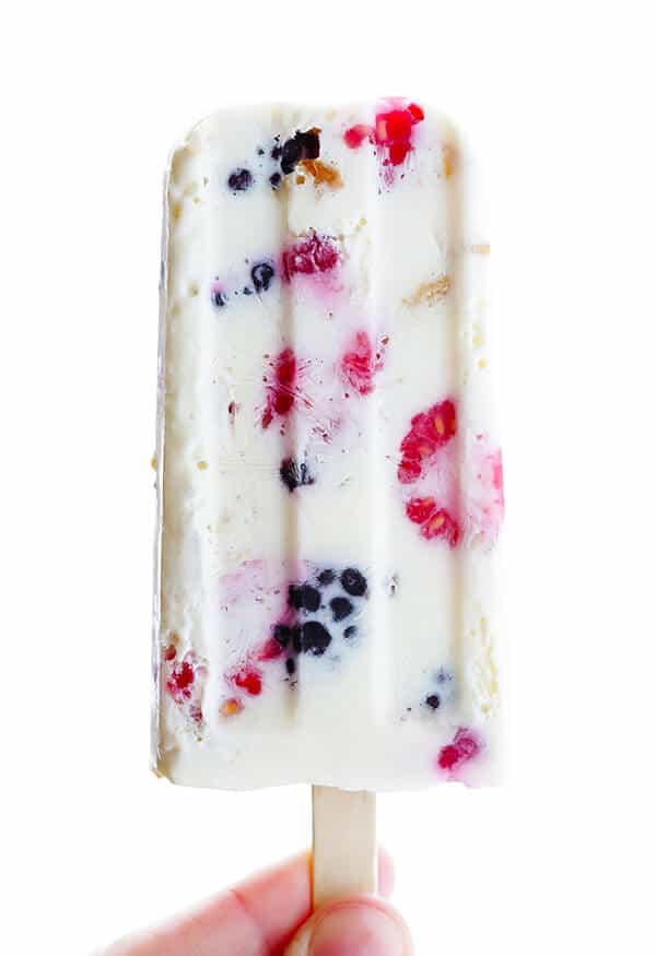 These Berry Cheesecake Popsicles are quick and easy to prep, they're chocked full of fresh berries and graham crackers, and they really do taste like cheesecake! | gimmesomeoven.com