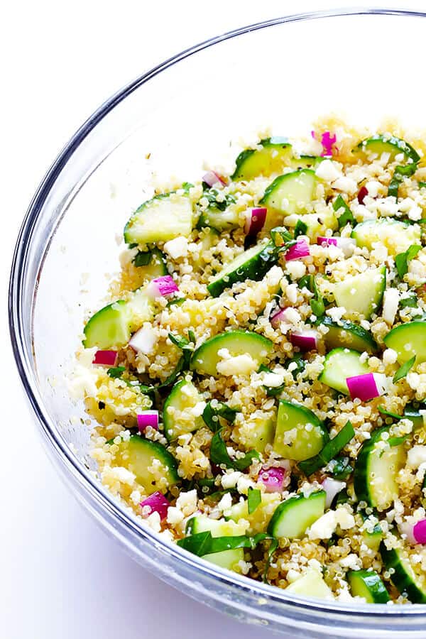 This Cucumber Quinoa Salad is made with lots of fresh basil and feta, tossed with a simple lemony vinaigrette, and it's SO fresh and delicious! Plus, it's naturally gluten-free and quick and easy to make. | gimmesomeoven.com