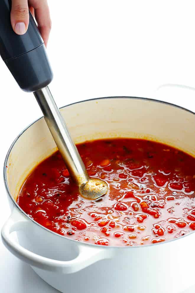 This 20-Minute Tomato Soup recipe is quick and easy to make, made with lots of fresh basil and garlic, and absolutely delicious! | gimmesomeoven.com (Vegan / Vegetarian / Gluten-Free)