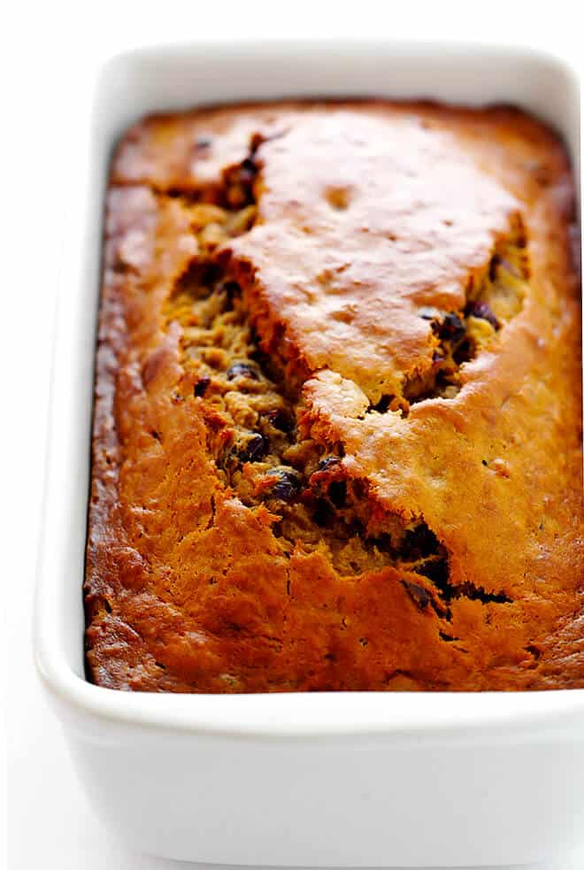 This Cranberry Orange Banana Bread recipe is easy to make, drizzled with a yummy orange glaze, and perfectly moist and delicious! | gimmesomeoven.com