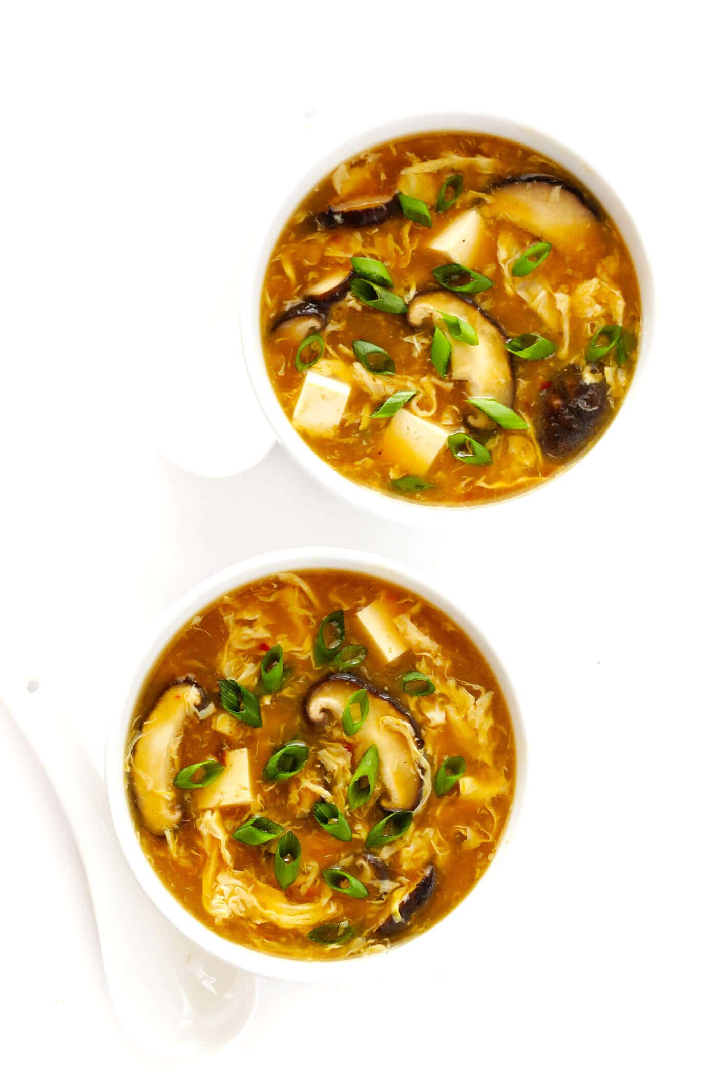 This amazing Hot and Sour Soup recipe is super-easy to make in just 25 minutes, and tastes even better than the Chinese restaurant version! It's also a great healthy dinner recipe that's naturally vegetarian and gluten-free. | gimmesomeoven.com #soup #chinese #dinner #glutenfree #vegetarian #healthy #side #takeout Hot and Sour Soup Recipe with Mushrooms and Tofu