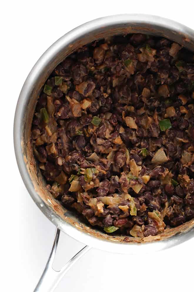 These easy Black Bean Breakfast Tacos are made with a zesty black bean filling, and you can top them with whatever you'd like! | gimmesomeoven.com