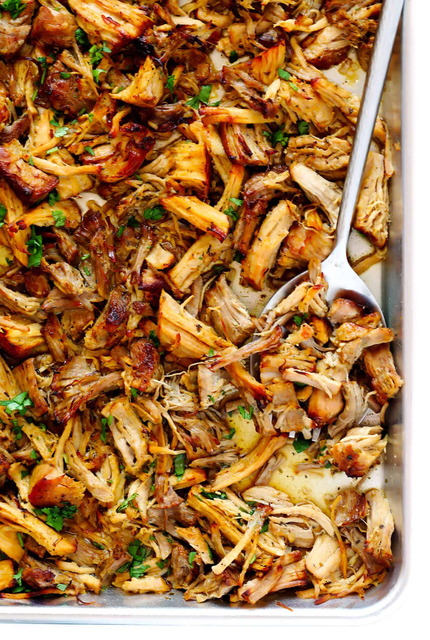 This Instant Pot Carnitas recipe is extra quick and easy to make in the pressure cooker. It's also simmered with a garlic citrus mojo sauce for extra flavor, then broiled briefly in the oven to make the pork extra crispy. Perfect for tacos, burritos, quesadillas, salads and more! | gimmesomeoven.com #carnitas #tacos #mexican #pork #dinner #instantpot #pressurecooker #mealprep Crispy Carnitas made in the Instant Pot