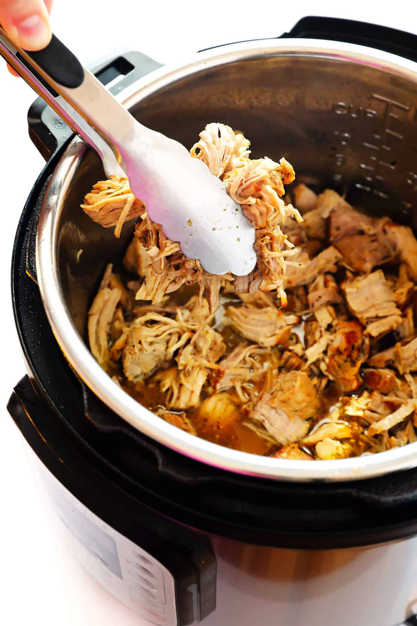 This Instant Pot Carnitas recipe is extra quick and easy to make in the pressure cooker. It's also simmered with a garlic citrus mojo sauce for extra flavor, then broiled briefly in the oven to make the pork extra crispy. Perfect for tacos, burritos, quesadillas, salads and more! | gimmesomeoven.com #carnitas #tacos #mexican #pork #dinner #instantpot #pressurecooker #mealprep Instant Pot Pork Carnitas