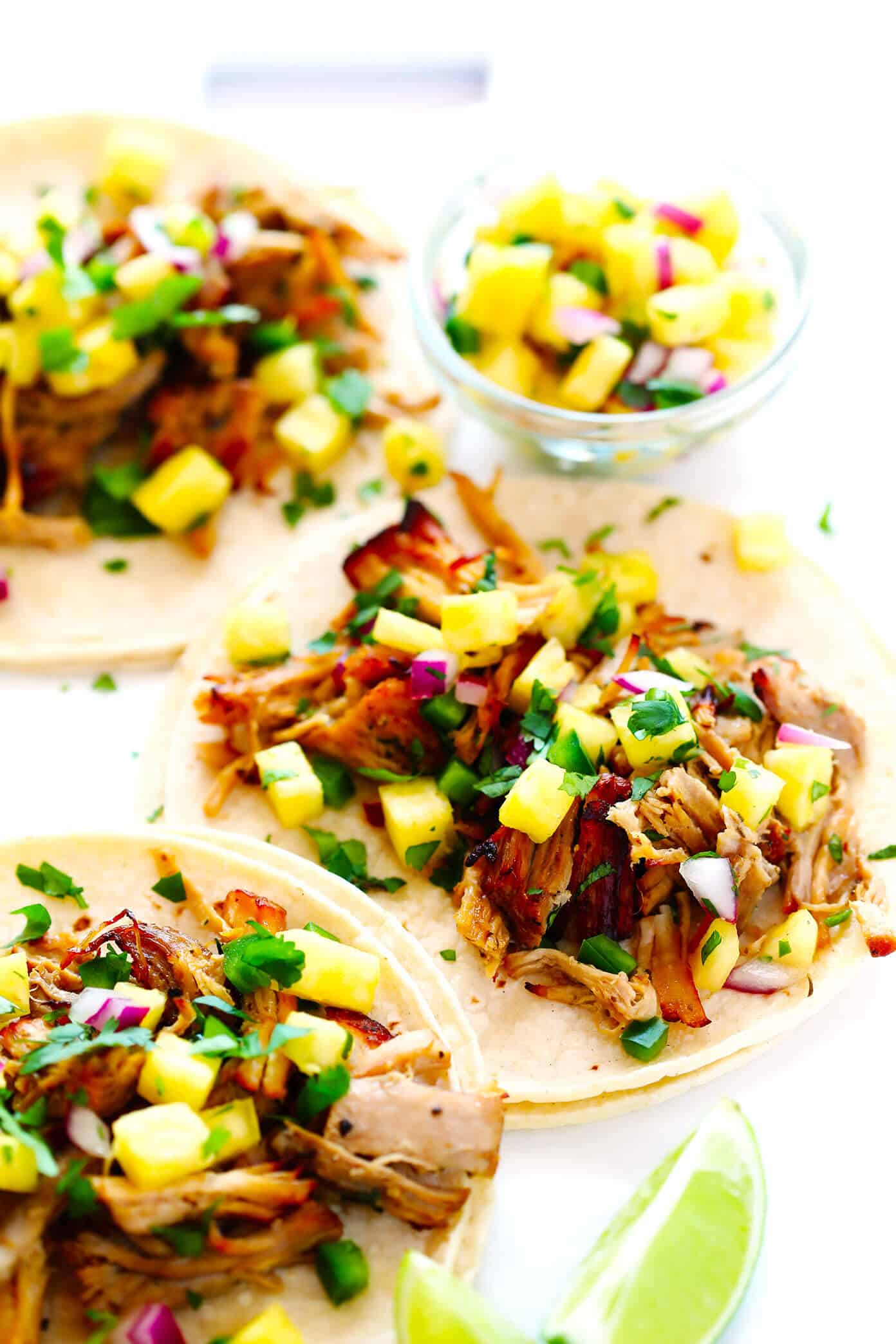This Instant Pot Carnitas recipe is extra quick and easy to make in the pressure cooker. It's also simmered with a garlic citrus mojo sauce for extra flavor, then broiled briefly in the oven to make the pork extra crispy. Perfect for tacos, burritos, quesadillas, salads and more! | gimmesomeoven.com #carnitas #tacos #mexican #pork #dinner #instantpot #pressurecooker #mealprep Instant Pot Carnitas