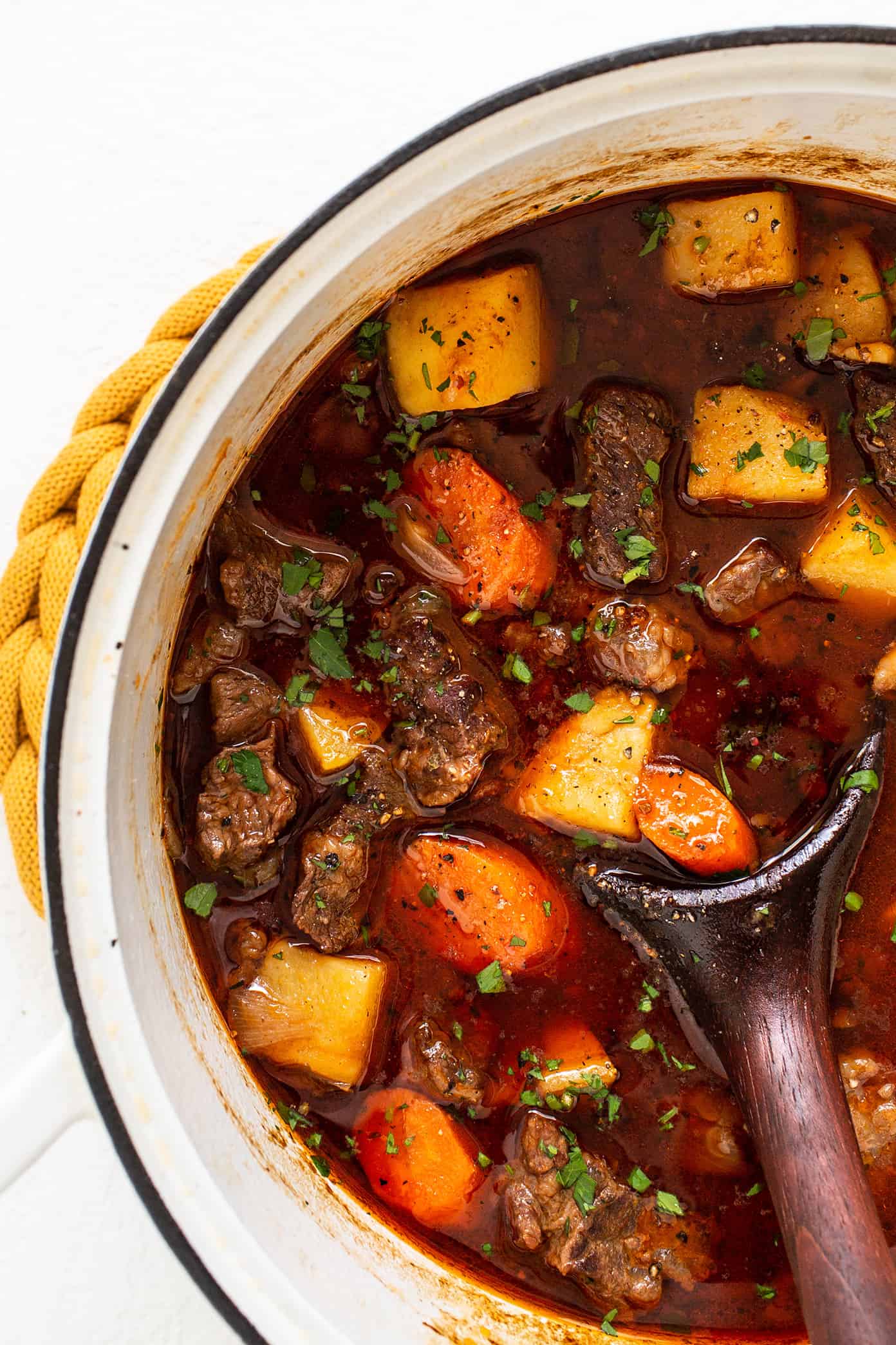 This Guinness Beef Stew recipe is full of tender beef, hearty potatoes, carrots and onions, and a richly-seasoned tomato stout gravy. It's easy to make and the perfect comfort food for St. Patrick's Day or anytime you're craving this Irish-inspired soup. Stovetop, Instant Pot and Crock-Pot options included. | gimmesomeoven.com Guinness Beef Stew