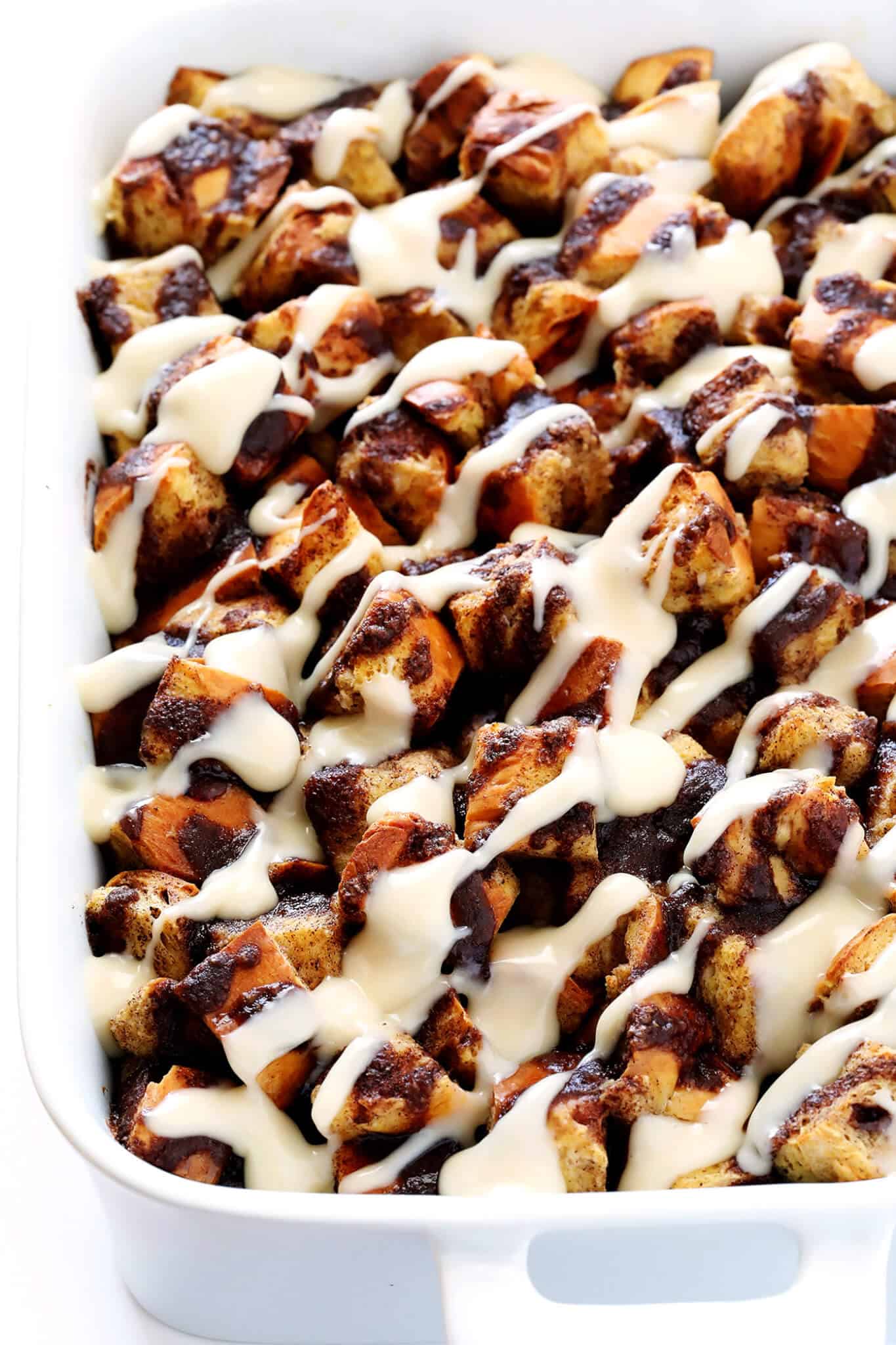 This Overnight Cinnamon Rolls Recipe is super-easy to make ahead of time, topped with a heavenly cream cheese icing, and absolutely delicious!! | gimmesomeoven.com
