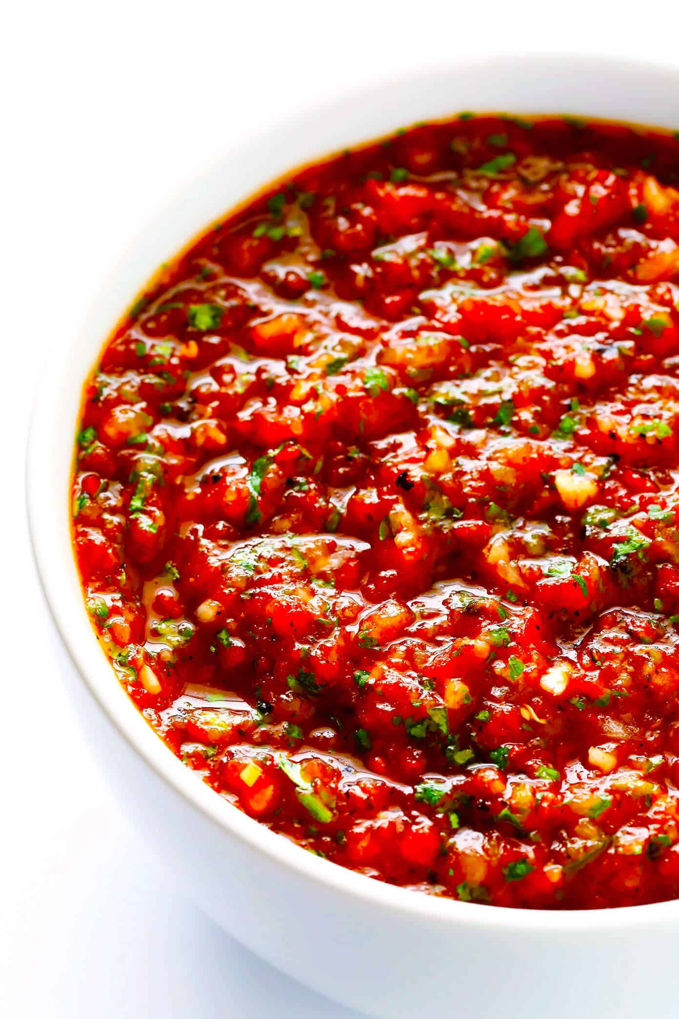 My all-time favorite homemade salsa recipe!! It's quick and easy to make in a food processor or blender, it's easy to make spicy or mild, and it is SO flavorful and delicious! | Gimme Some Oven #mexican #salsa #appetizer #dip #easyrecipes The BEST homemade restaurant-style salsa recipe