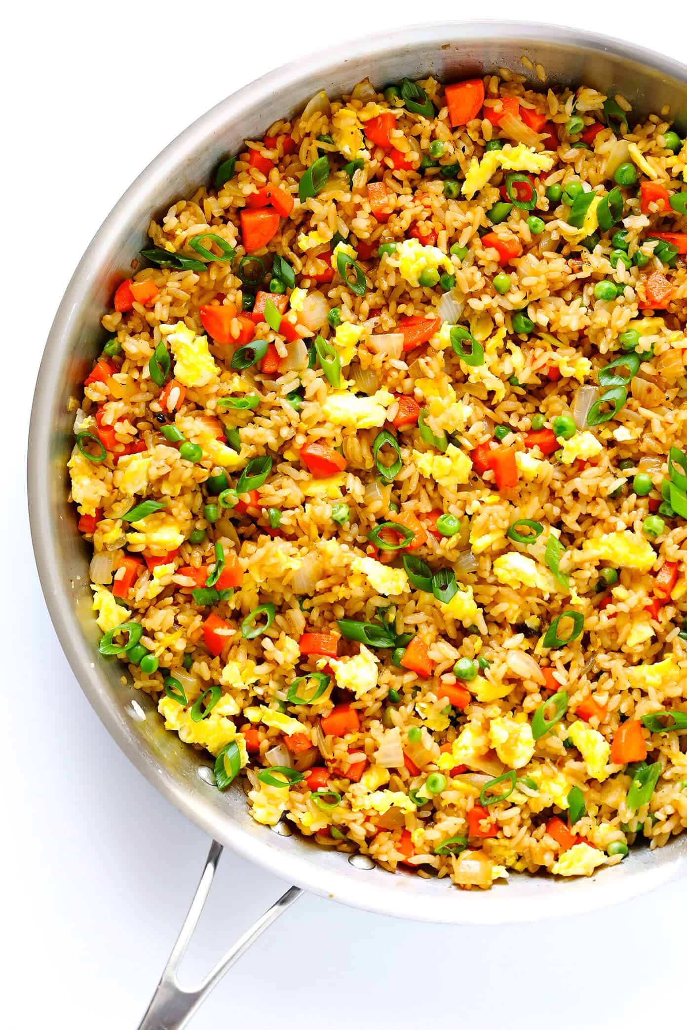 The BEST homemade fried rice recipe!! It only takes 15 minutes to make, it's easy to customize with your favorite add-ins (like chicken, pork, beef, shrimp, tofu, and/or vegetables), and it is SO flavorful and delicious! Way better than any Chinese takeout I've ever tried. ;) | gimmesomeoven.com #friedrice #chinese #dinner #recipe #vegetarian #takeout #rice The BEST Fried Rice Recipe | 20 Vegetarian Dinner Ideas