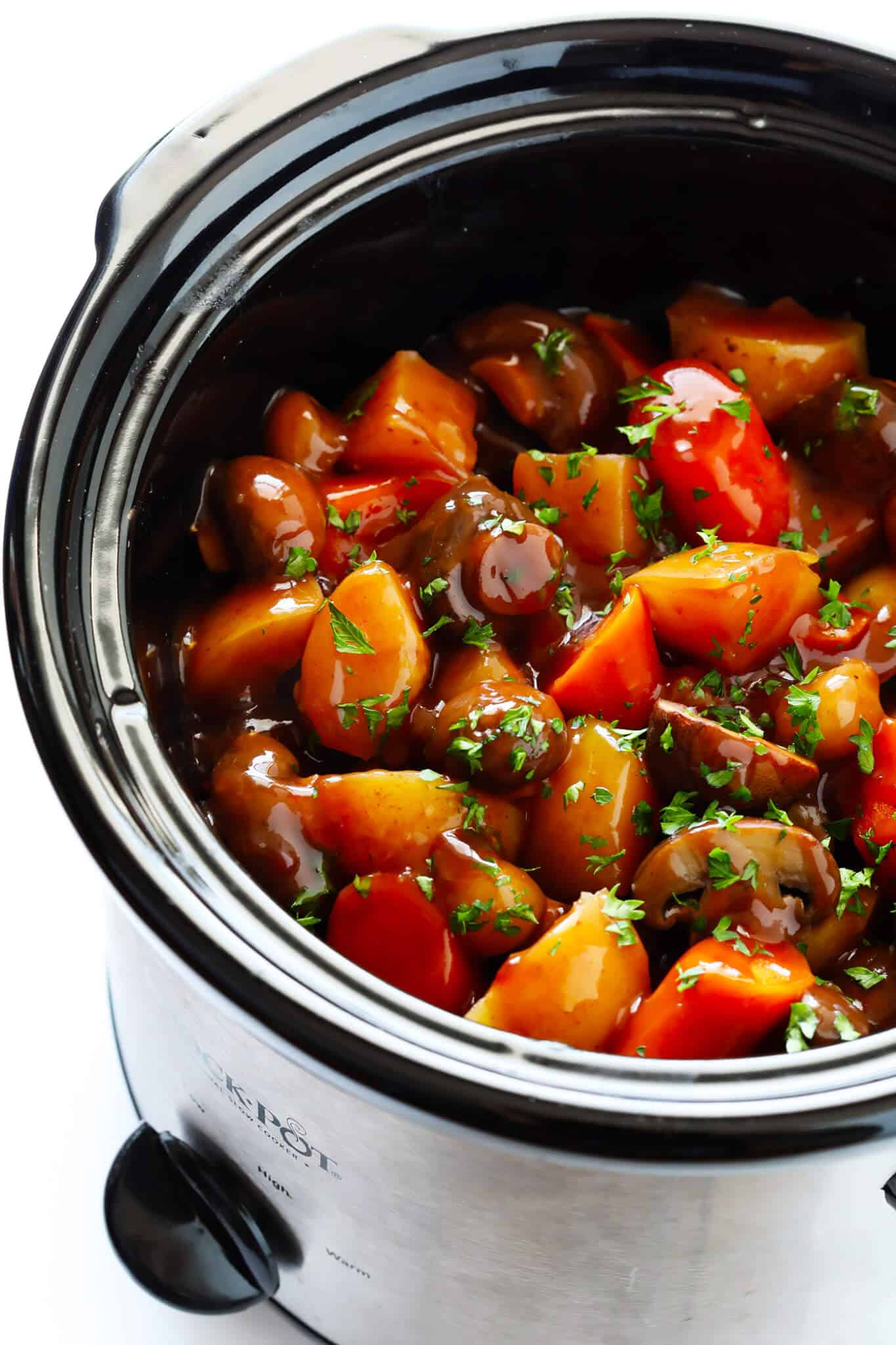 This Portobello Pot Roast recipe is easy to make in the slow cooker or pressure cooker (Instant Pot), it's full of tender potatoes, mushrooms, carrots, onions, garlic and a savory gravy, it's naturally gluten-free, vegetarian and vegan, and it's TOTALLY delicious! My kind of comfort food! | gimmesomeoven.com #potroast #vegetarian #vegan #glutenfree #mushroom #healthy #dinner #recipe Vegetarian Portobello Pot Roast Recipe | 20 Vegetarian Dinner Ideas