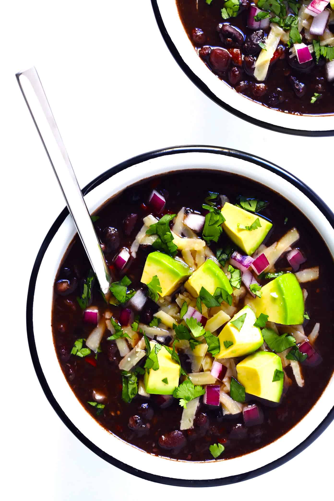 The BEST Black Bean Chili recipe! It's easy to make in the Instant Pot or Crock-Pot or stovetop, it's naturally gluten-free, vegan and vegetarian, and it's full of the most delicious zesty Mexican flavors. | Gimme Some Oven #blackbeanchili #mealprep #vegetarianchili #veganchili #instantpotchili The BEST Black Bean Chili Recipe with Avocado