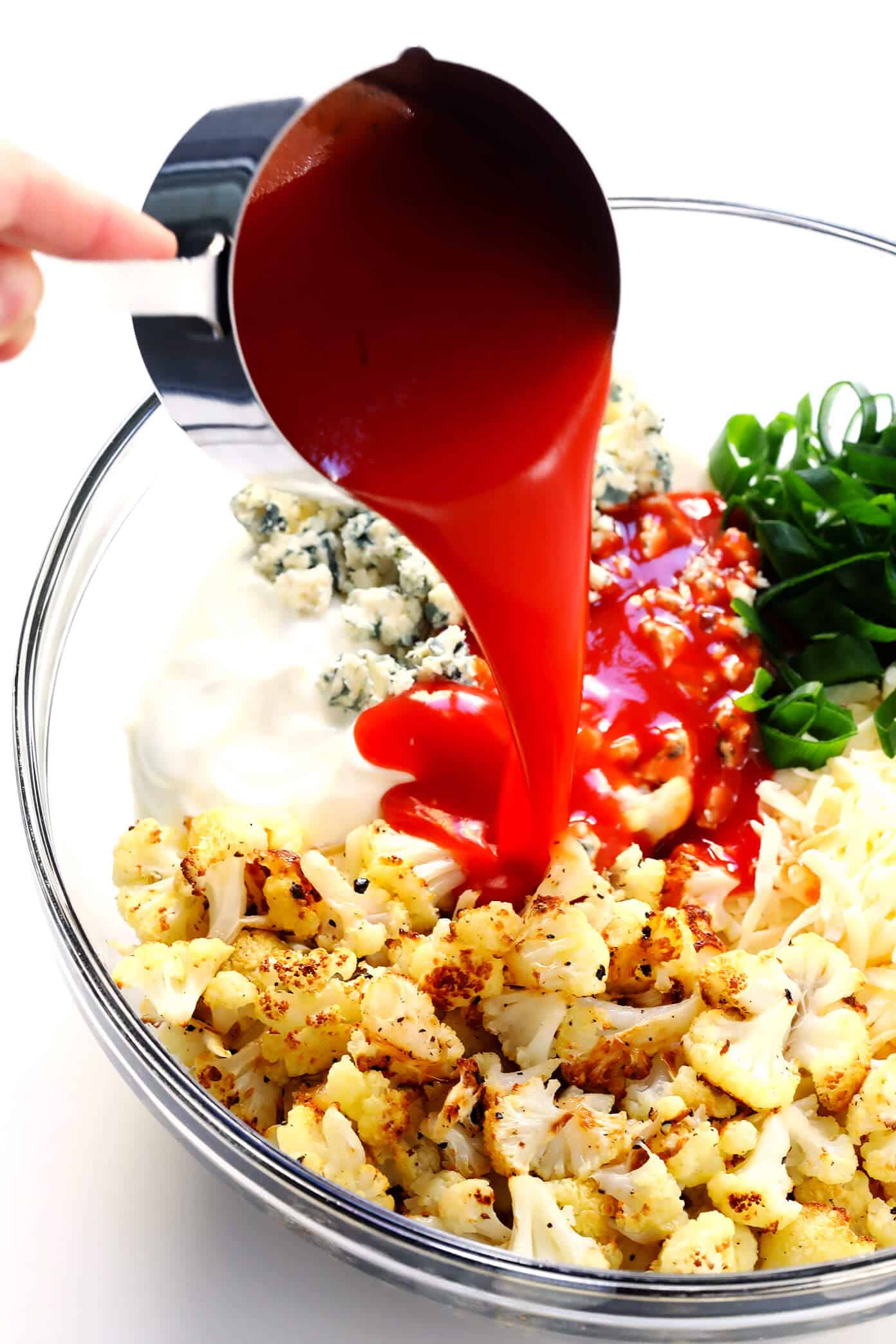 Love this vegetarian Buffalo Cauliflower Dip! It's easy to make in the oven or slow cooker, it's full of big flavors, and it's the perfect appetizer for game day! | Gimme Some Oven #buffalocauliflower #diprecipes #appetizer #vegetarianrecipes Buffalo Cauliflower Dip with Hot Sauce