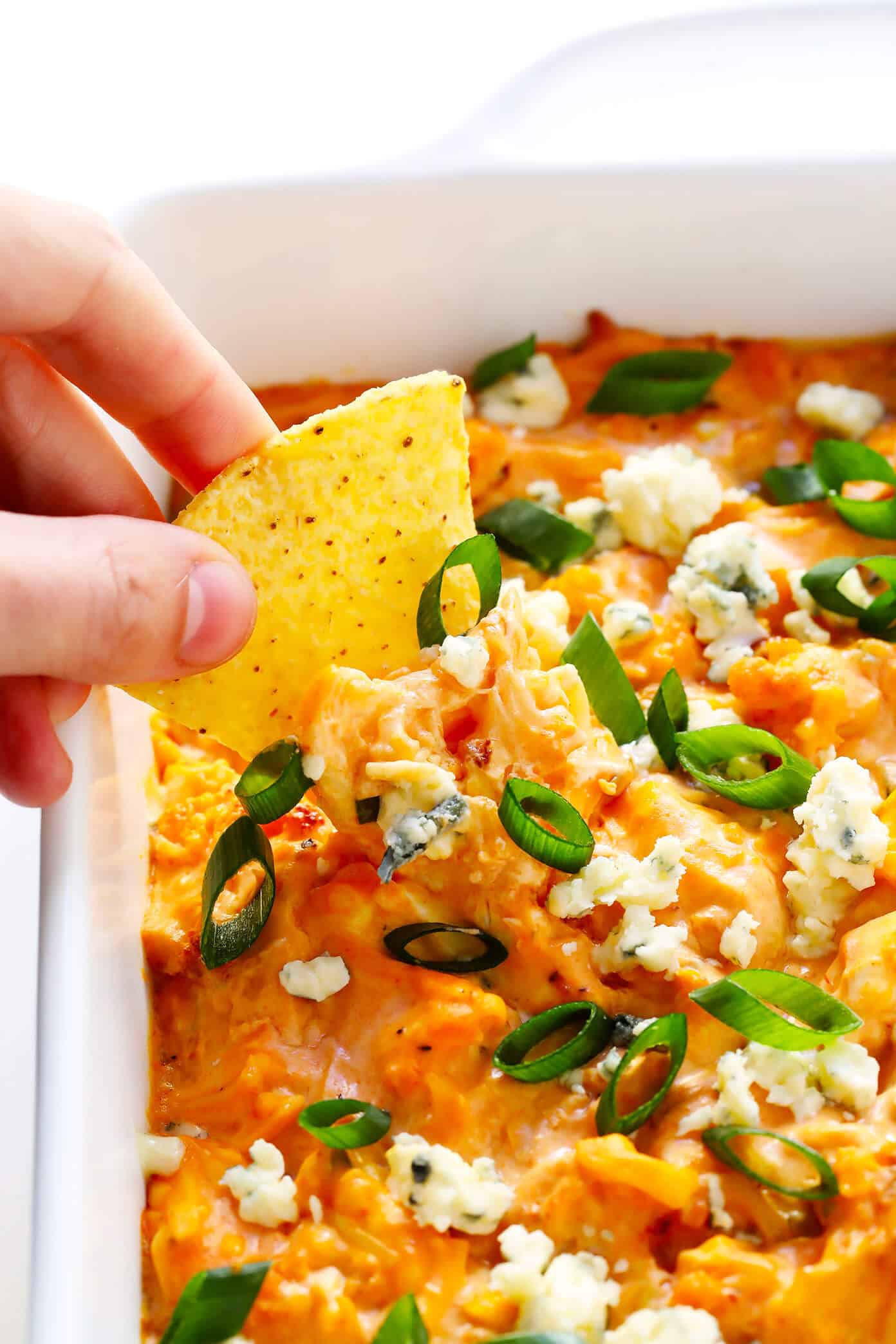 Love this vegetarian Buffalo Cauliflower Dip! It's easy to make in the oven or slow cooker, it's full of big flavors, and it's the perfect appetizer for game day! | Gimme Some Oven #buffalocauliflower #diprecipes #appetizer #vegetarianrecipes Vegetarian Buffalo Cauliflower Dip with Chip