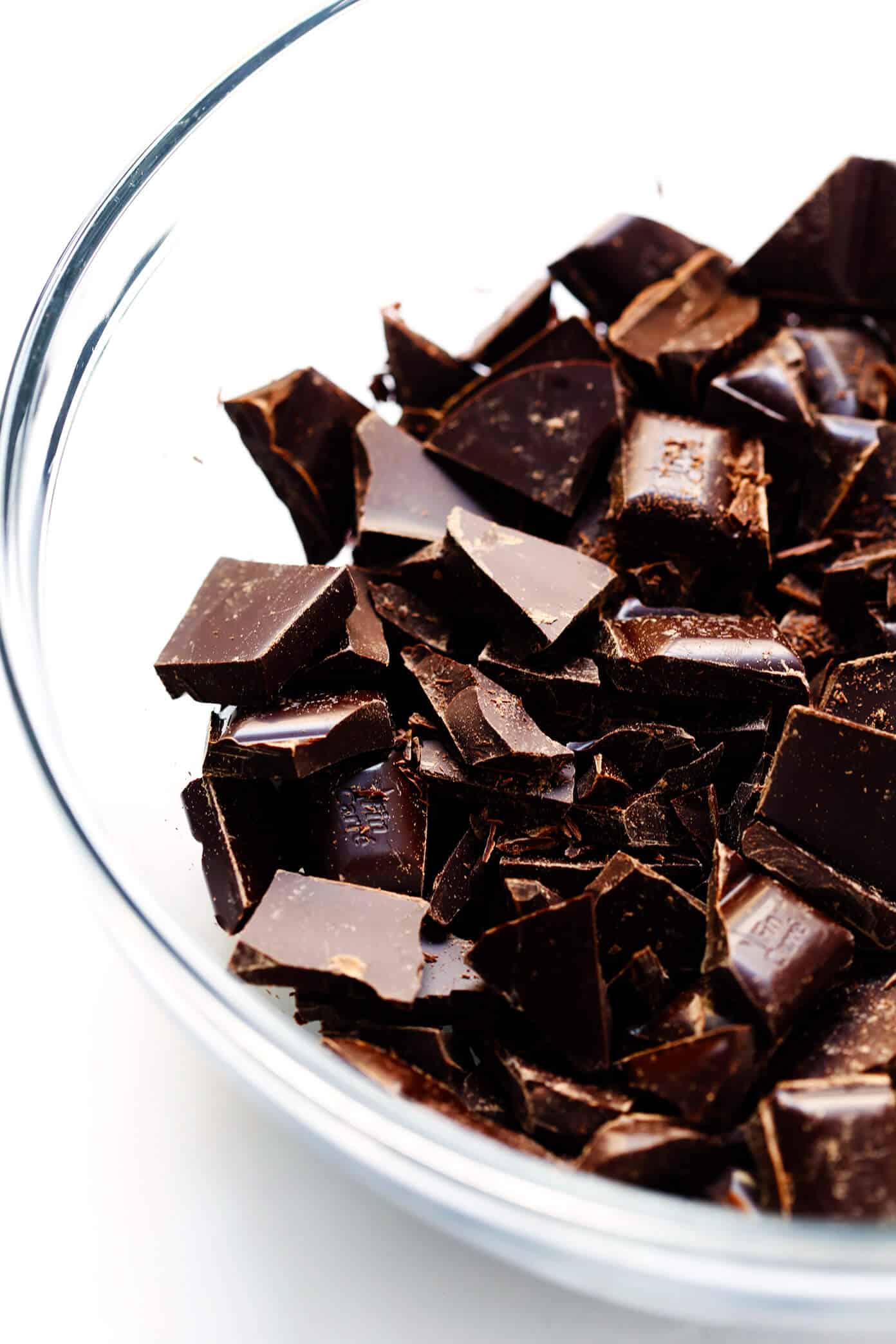 LOVE this Salted Dark Chocolate Tart recipe! It's quick and easy to make ahead, made with a gluten-free almond crust and zero heavy cream, and it's SO decadent and delicious. The perfect dessert for Valentine's Day or anytime you're craving some chocolate. | Gimme Some Oven #chocolate #tart #darkchocolate #dessert #sweets #valentines #glutenfree #vegan #vegetarian Chopped Dark Chocolate Bars