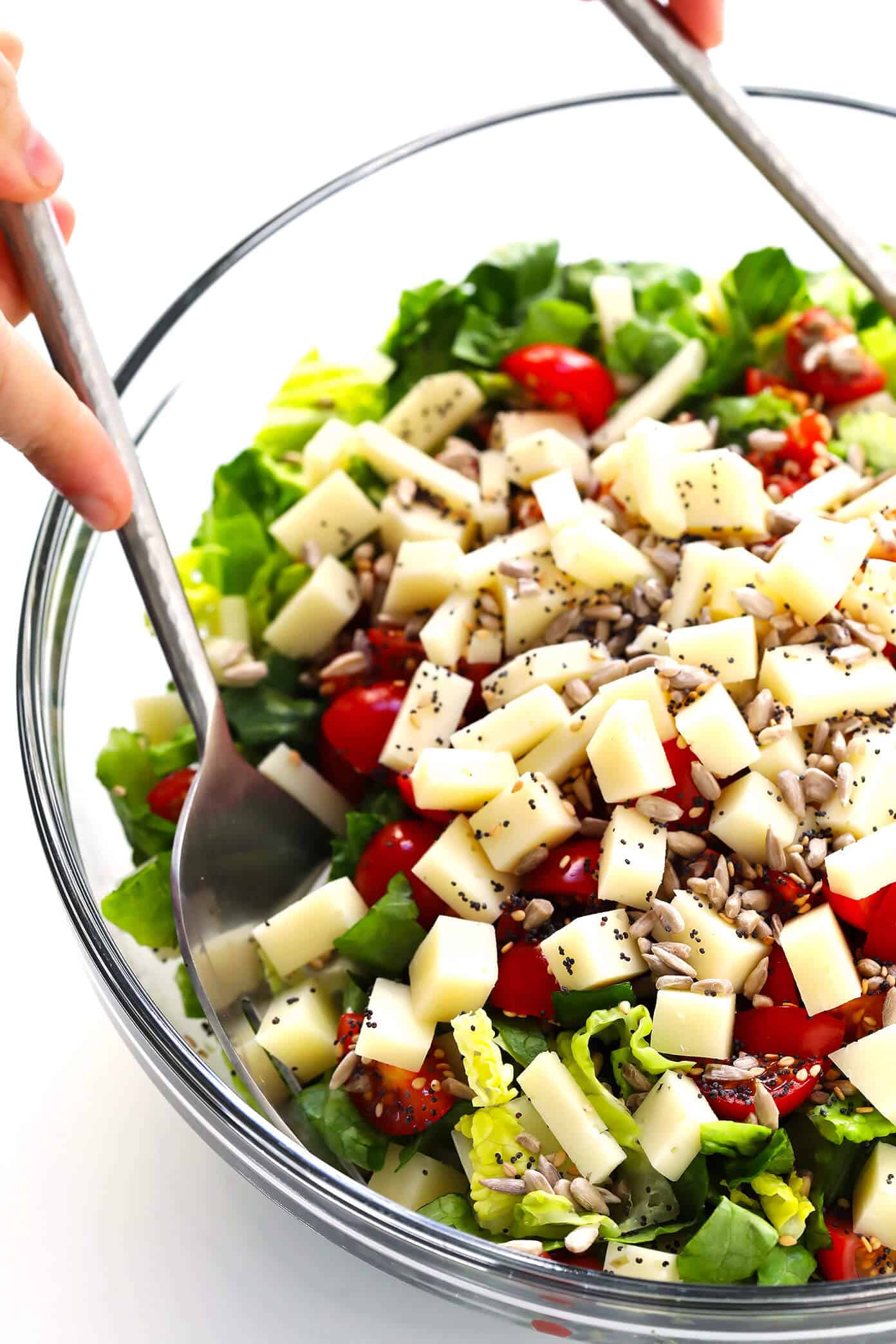 This unforgettable Italian chopped salad is made with lots of tomatoes, fresh basil, Pecorino cheese, Romaine lettuce, balsamic drizzle. And a surprise topping -- everything bagel seasoning! | Gimme Some Oven #salad #italian #choppedsalad #caprese #balsamic Unforgettable Italian Chopped Salad Prep