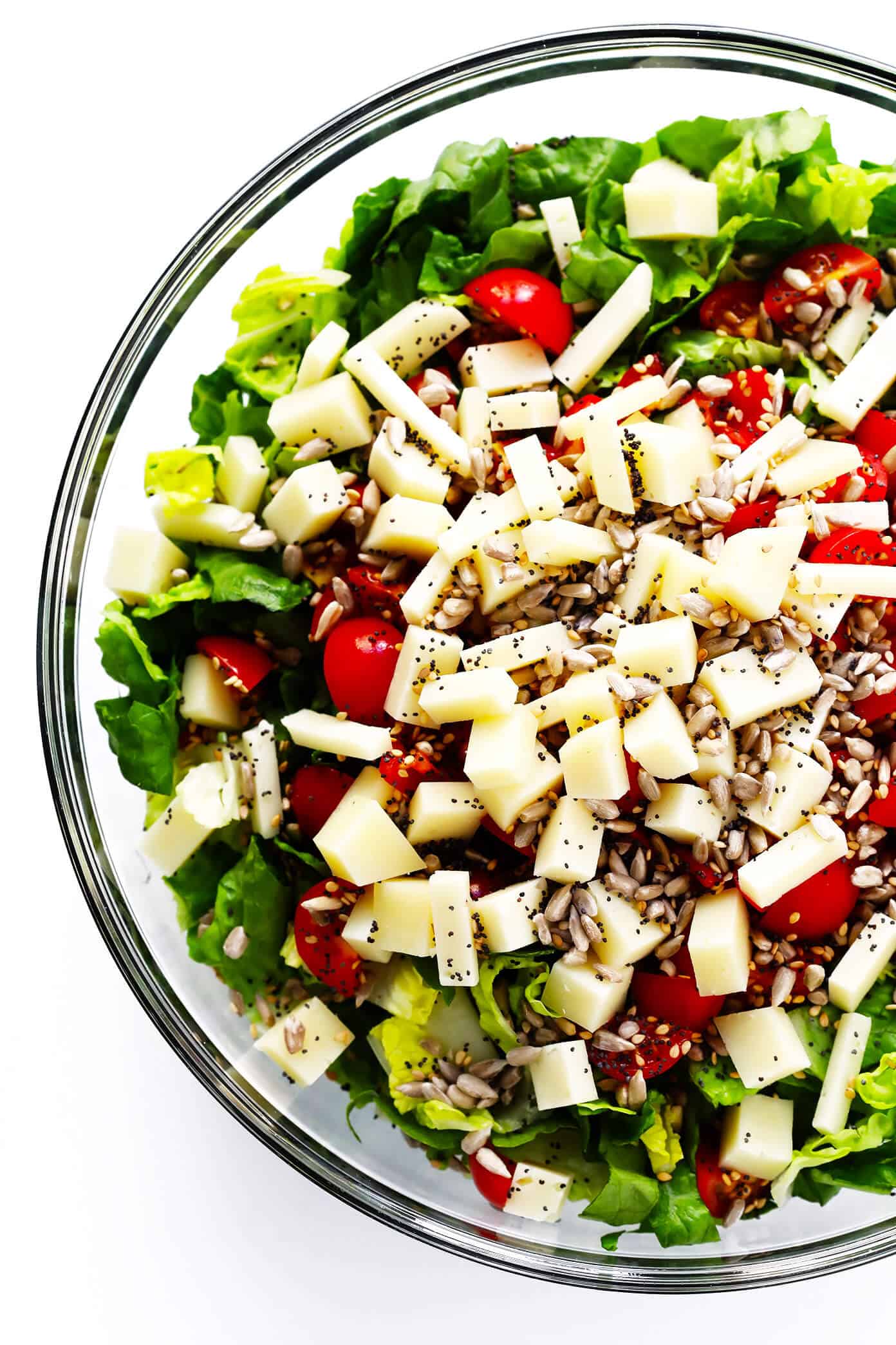 This unforgettable Italian chopped salad is made with lots of tomatoes, fresh basil, Pecorino cheese, Romaine lettuce, balsamic drizzle. And a surprise topping -- everything bagel seasoning! | Gimme Some Oven #salad #italian #choppedsalad #caprese #balsamic Unforgettable Italian Chopped Salad Ingredients