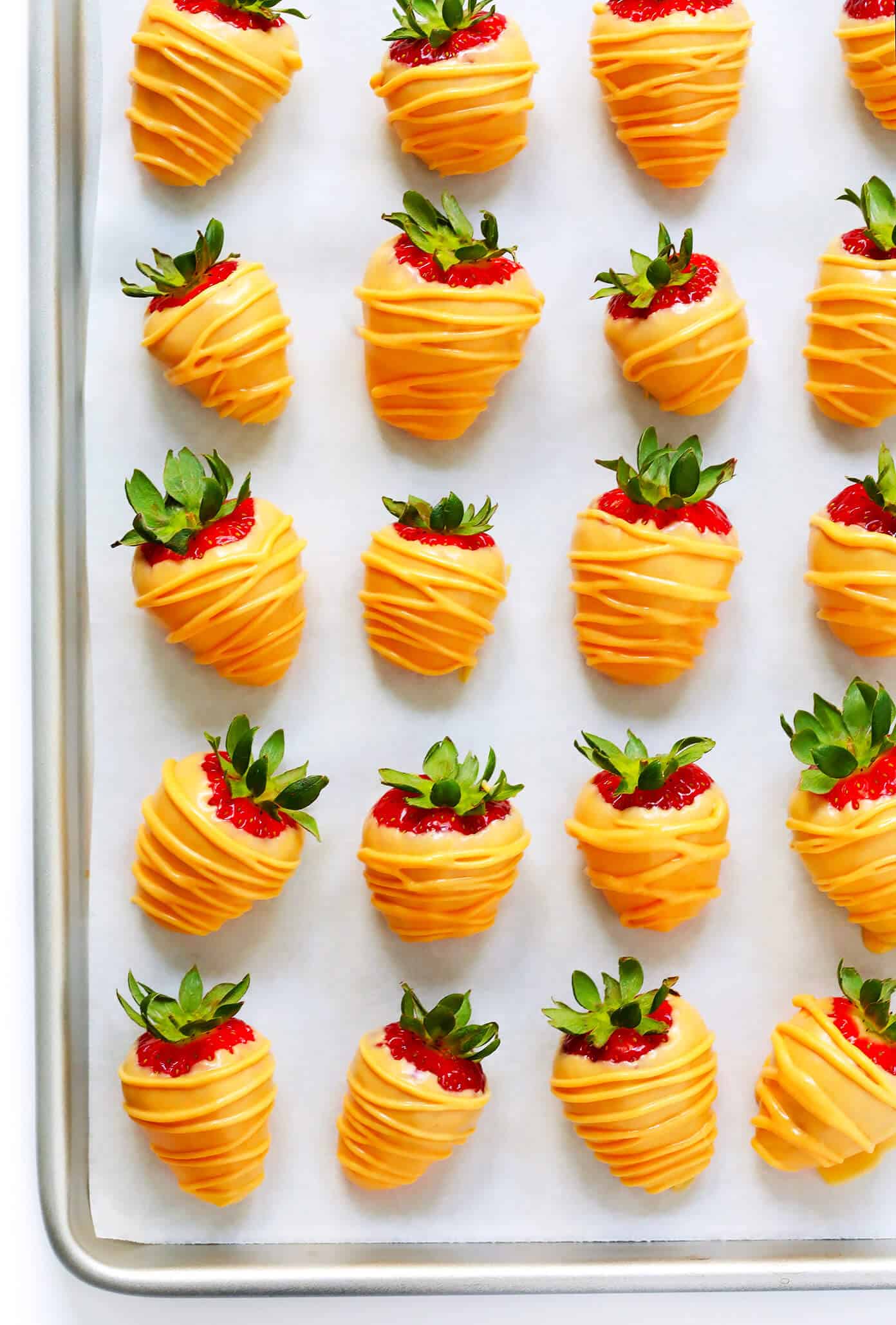 Love these Carrot Patch "Dirt" Cups! They're made with a chocolate avocado mousse pudding "dirt cake", chocolate-covered strawberry "carrots", and a sprinkling of Oreos, and they are SO delicious and fun! The perfect Spring (or Easter!) dessert that kids and adults will love alike. | Gimme Some Oven #dirtcake #easter #spring #chocolate #dessert #treats Chocolate-Covered Strawberries