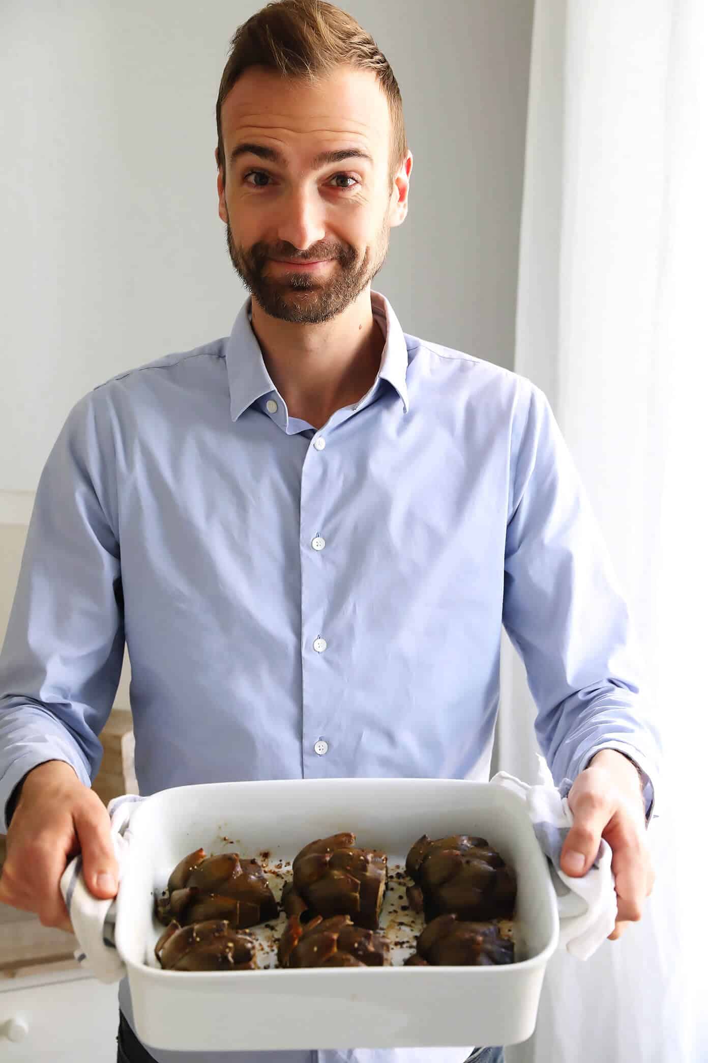 Seriously the most amazing roasted artichokes recipe! They're stuffed with lots of garlic and herbs, seasoned with lots of lemon and black pepper, and roasted to crispy, tender perfection. The perfect vegetable side dish! | Gimme Some Oven #artichokes #roasted #sidedish #vegetable #glutenfree #vegan Barclay's Famous Roasted Artichokes Recipe